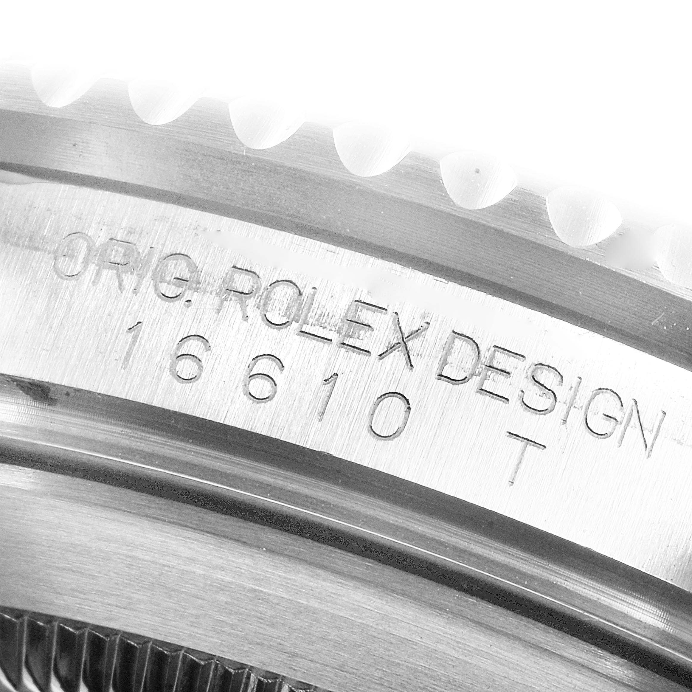 This image shows a close-up of the engraved serial number and design details on the side of the Rolex Submariner 16610 Men
s Stainless Steel Black Dial 16610 Men
s Stainless Steel Black Dial
s case.