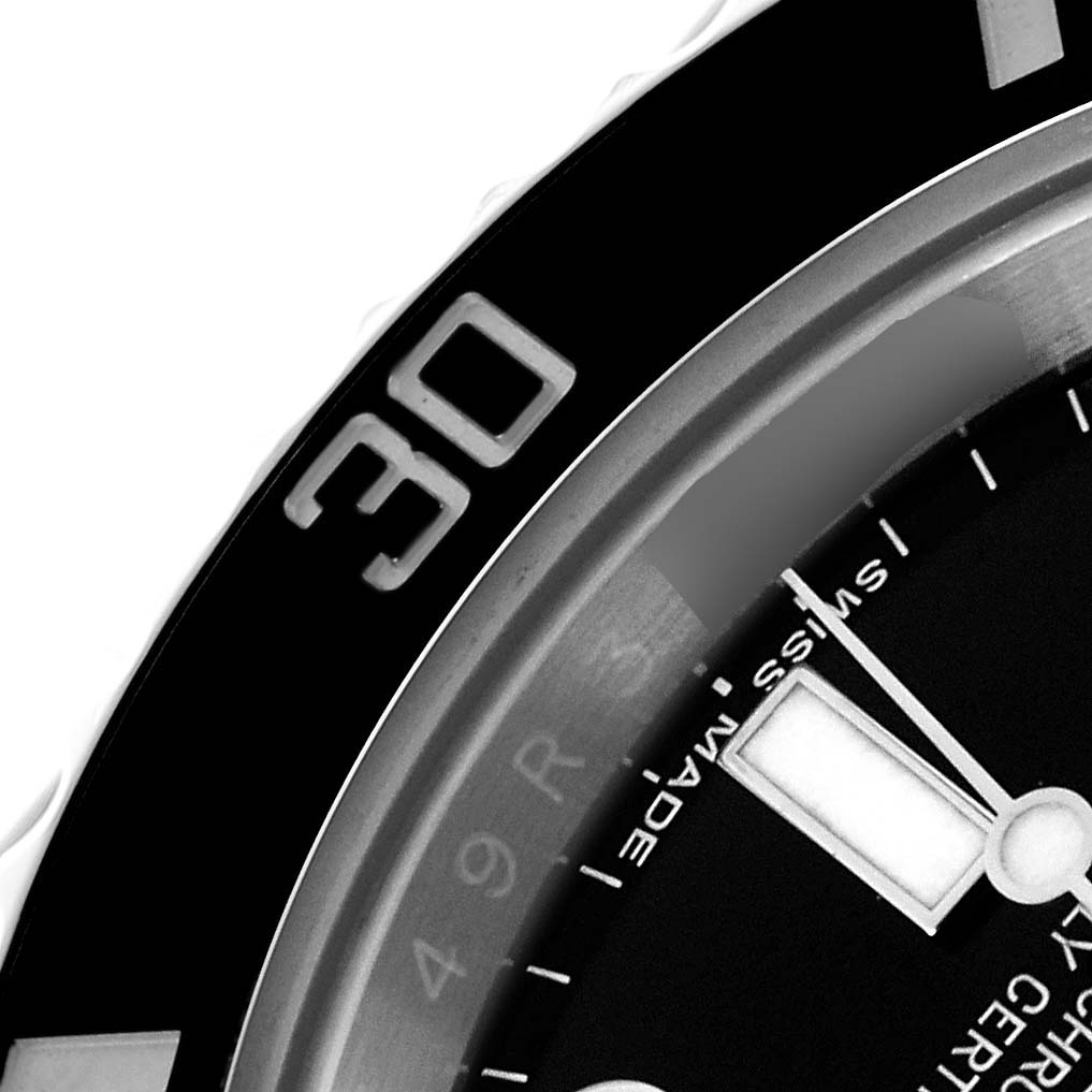 The image shows a close-up of the bezel and dial edge of a Rolex Submariner 116610LN Men
s Stainless Steel Black Dial 116610LN Men
s Stainless Steel Black Dial, highlighting the 30-minute marker.