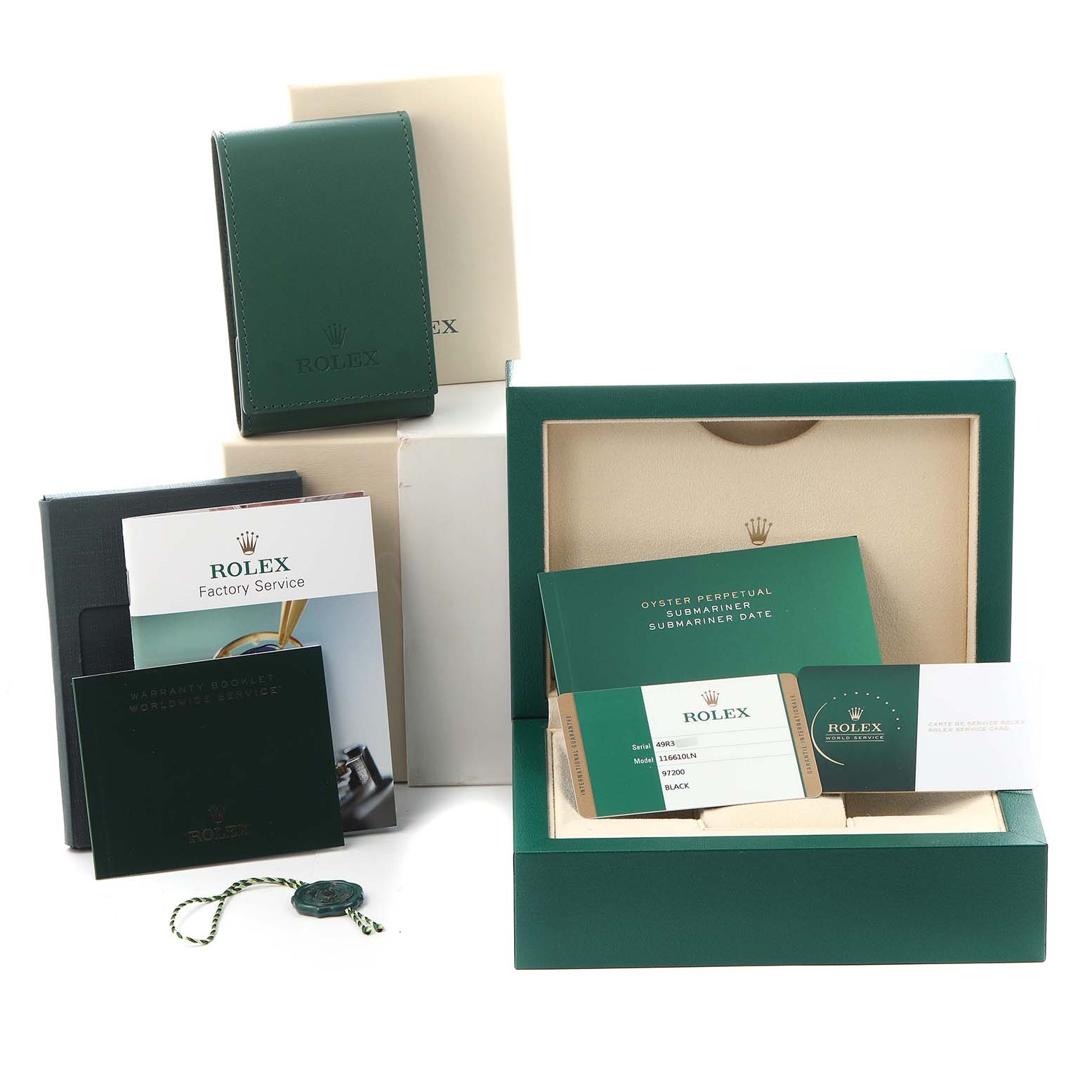 The image shows the packaging and accessories for the Rolex Submariner 116610LN Men
s Stainless Steel Black Dial 116610LN Men
s Stainless Steel Black Dial, including boxes, booklets, and a tag.