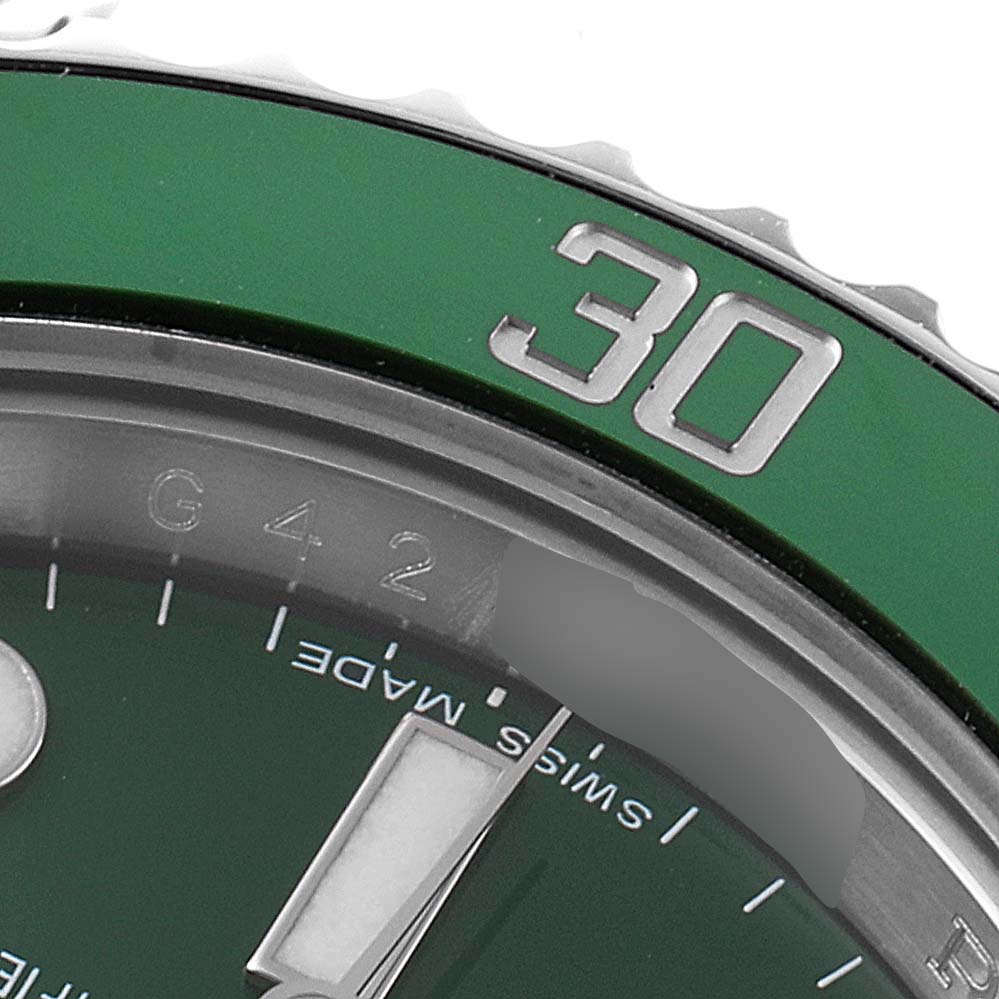 This image shows a close-up of the dial and bezel of a Rolex Submariner 116610LV Men
s Stainless Steel Green Dial 116610LV Men
s Stainless Steel Green Dial watch, specifically the 30-minute mark on the bezel.