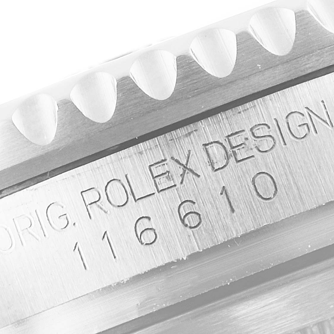 The image shows a close-up of the Rolex Submariner 116610LV Men
s Stainless Steel Green Dial 116610LV Men
s Stainless Steel Green Dial watch model 116610 with focus on the case and engraved design details.