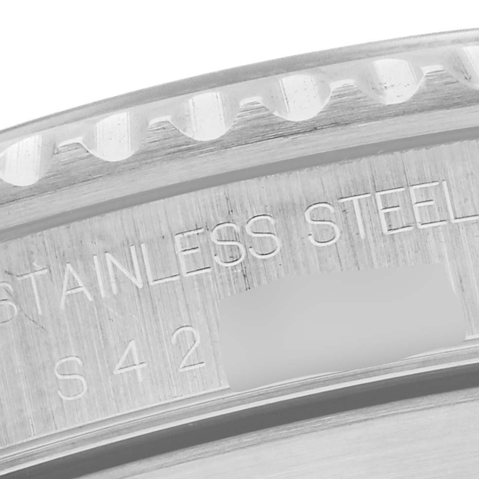 This close-up image shows the engraved stainless steel detail on the bezel edge of a Rolex Submariner 14060 Men
s Stainless Steel Black Dial 14060 Men
s Stainless Steel Black Dial watch.