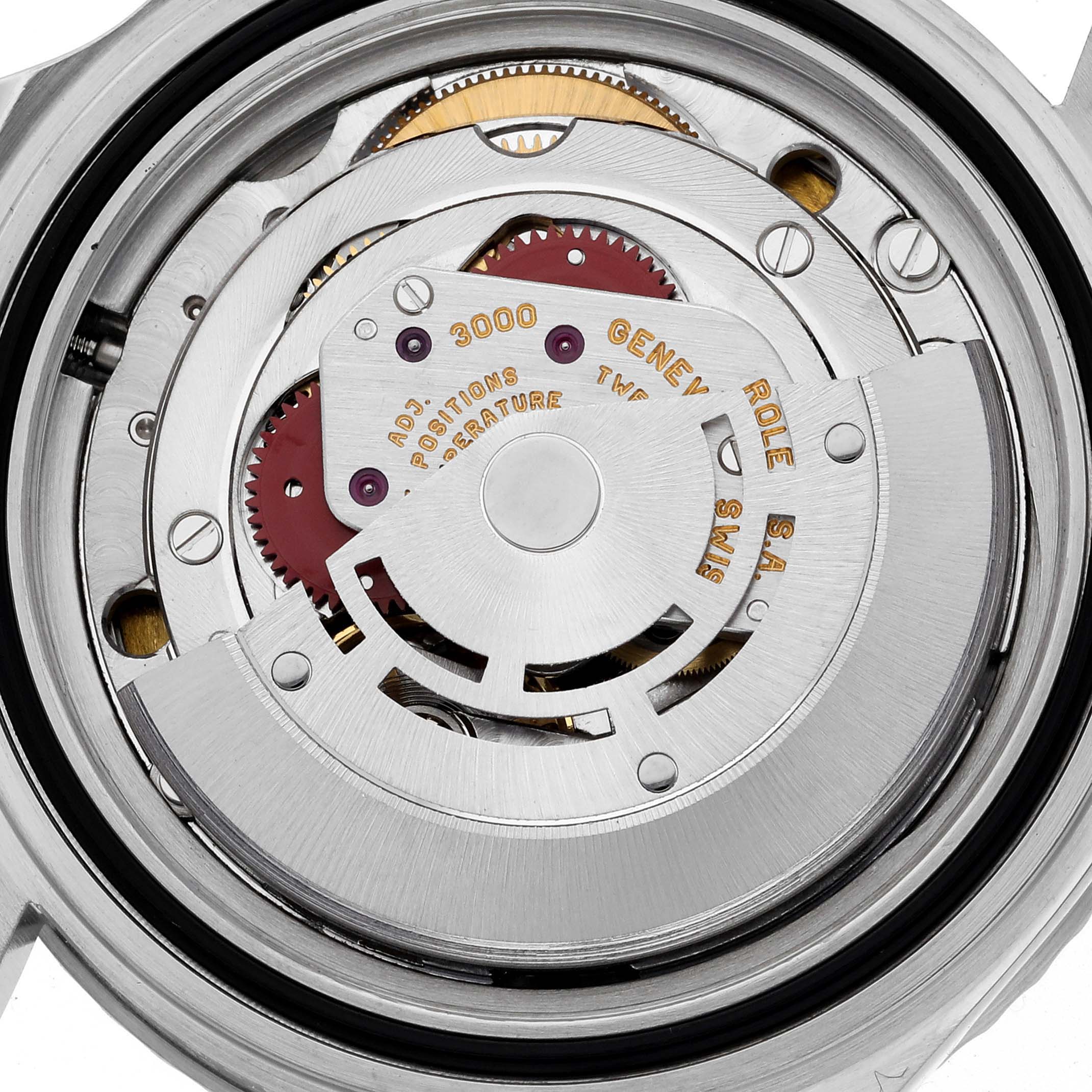 This is an image of the Rolex Submariner 14060 Men
s Stainless Steel Black Dial 14060 Men
s Stainless Steel Black Dial
s movement, showing gears and internal components in close-up.