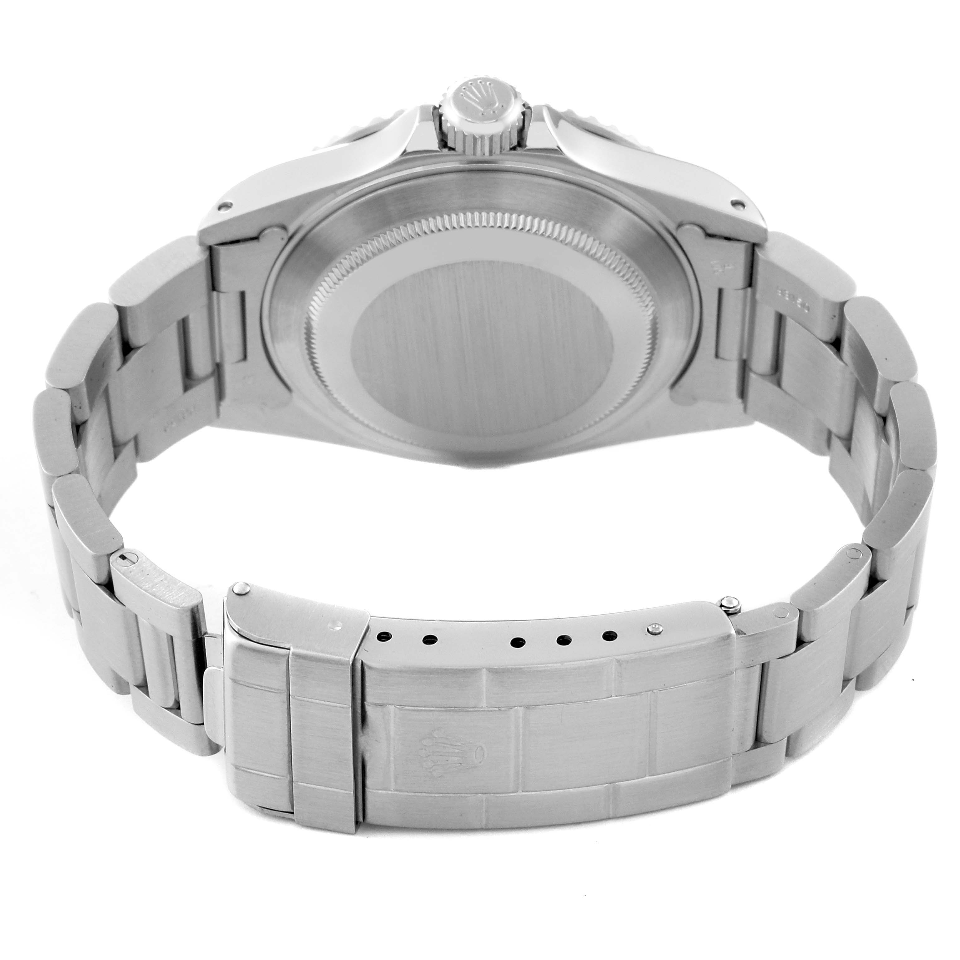 The image shows the back view of a Rolex Submariner 14060 Men
s Stainless Steel Black Dial 14060 Men
s Stainless Steel Black Dial watch, highlighting its case back and metal bracelet with the clasp partially open.