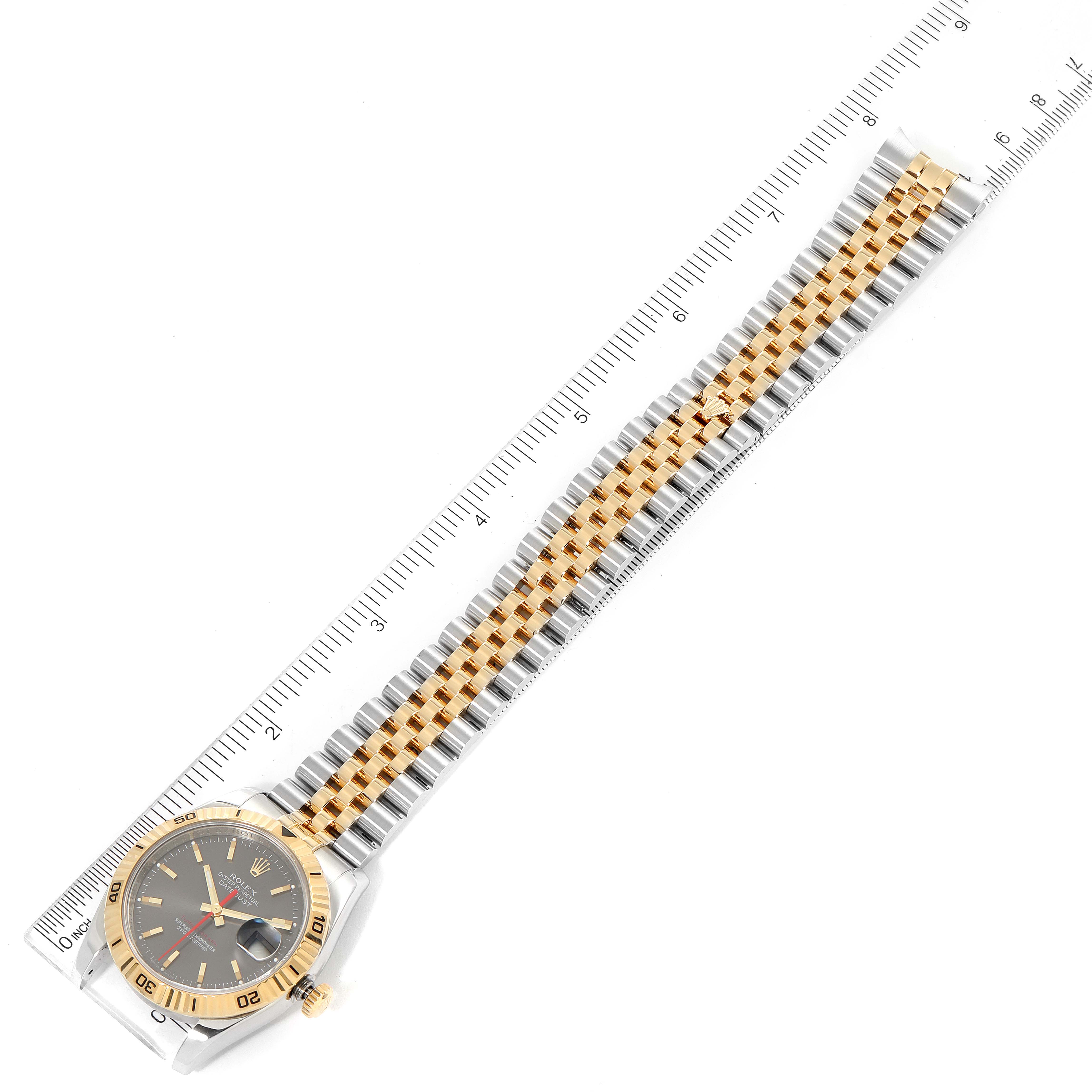 This Rolex Turn-o-Graph 116263 Men
s Steel and Gold (two tone) Grey Dial 116263 Men
s Steel and Gold (two tone) Grey Dial watch is displayed flat, showing the face, bezel, bracelet, and a measuring scale.