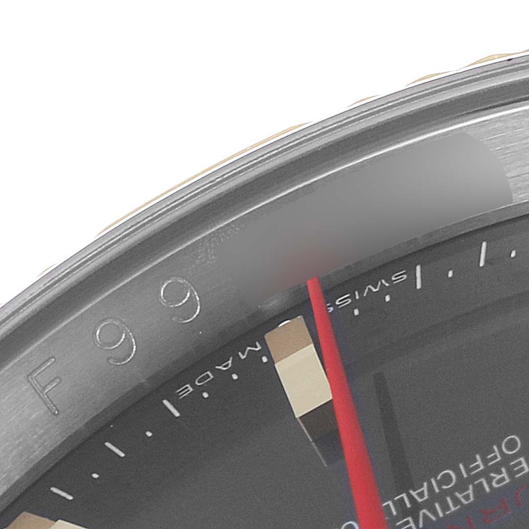 This image shows a close-up of the bezel and part of the dial of a Rolex Turn-o-Graph 116263 Men
s Steel and Gold (two tone) Grey Dial 116263 Men
s Steel and Gold (two tone) Grey Dial watch, highlighting its markings and red hand.