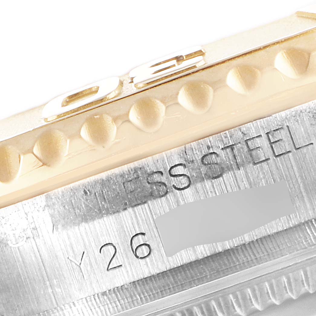 Close-up view of a Rolex Yacht-Master 168623 Men
s Steel and Gold (two tone) Blue Dial 168623 Men
s Steel and Gold (two tone) Blue Dial watch
s bezel and case showing details of the stainless steel and markings.