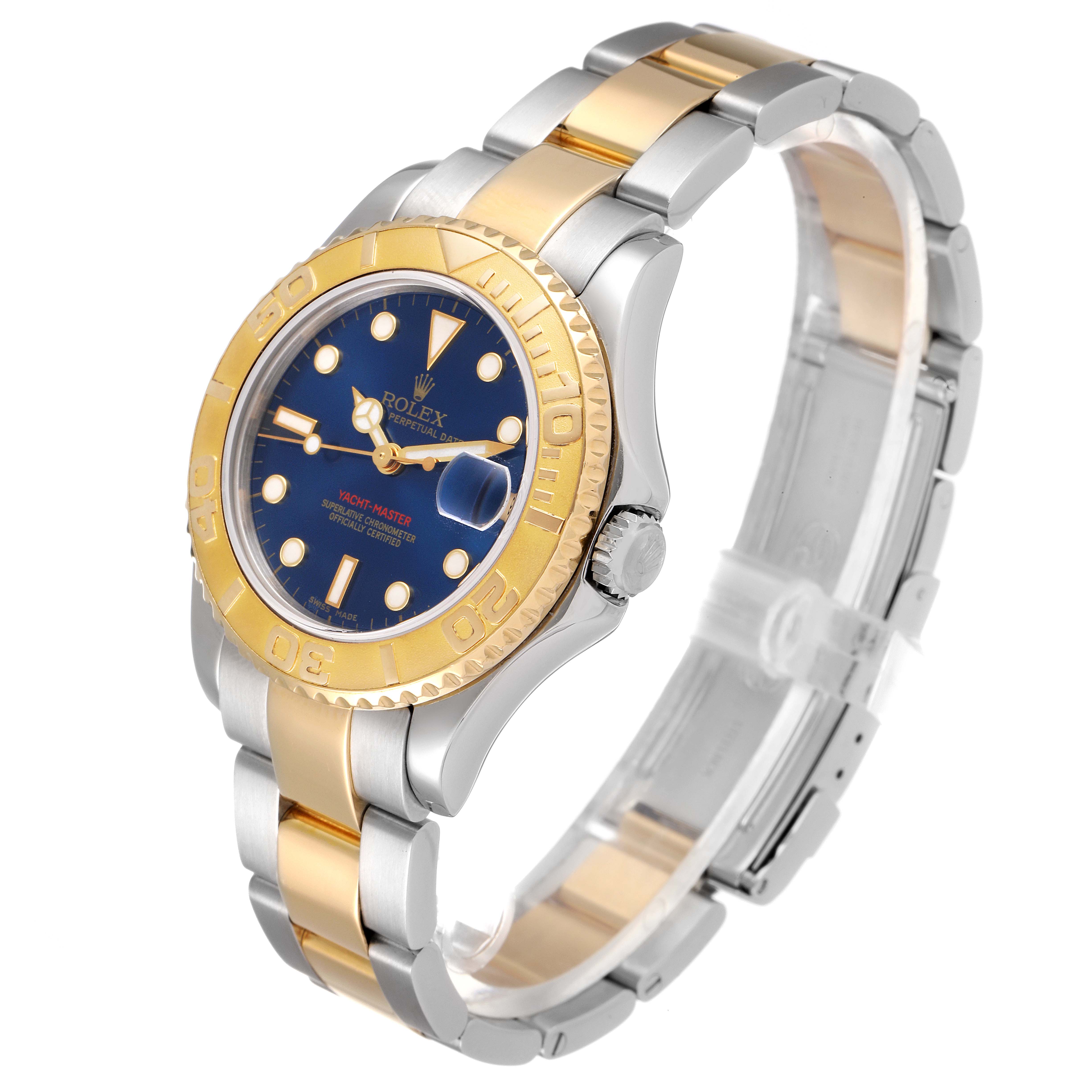This Rolex Yacht-Master 168623 Men
s Steel and Gold (two tone) Blue Dial 168623 Men
s Steel and Gold (two tone) Blue Dial watch is shown at an angle displaying the face, bezel, crown, and bracelet.