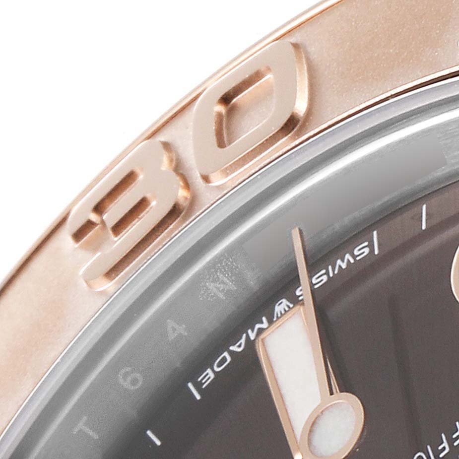 This close-up image focuses on the bezel, markers, and part of the dial of the Rolex Yacht-Master 268621 Men's Steel and Gold (two tone) Brown Dial 268621 Men's Steel and Gold (two tone) Brown Dial watch.