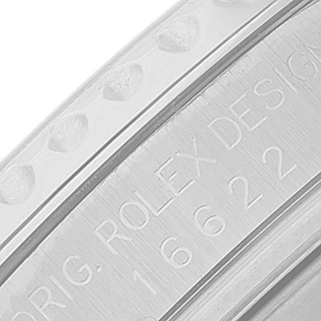 This image shows a close-up of the edge of a Yacht-Master Rolex watch, focusing on the engraved serial numbers and design details.