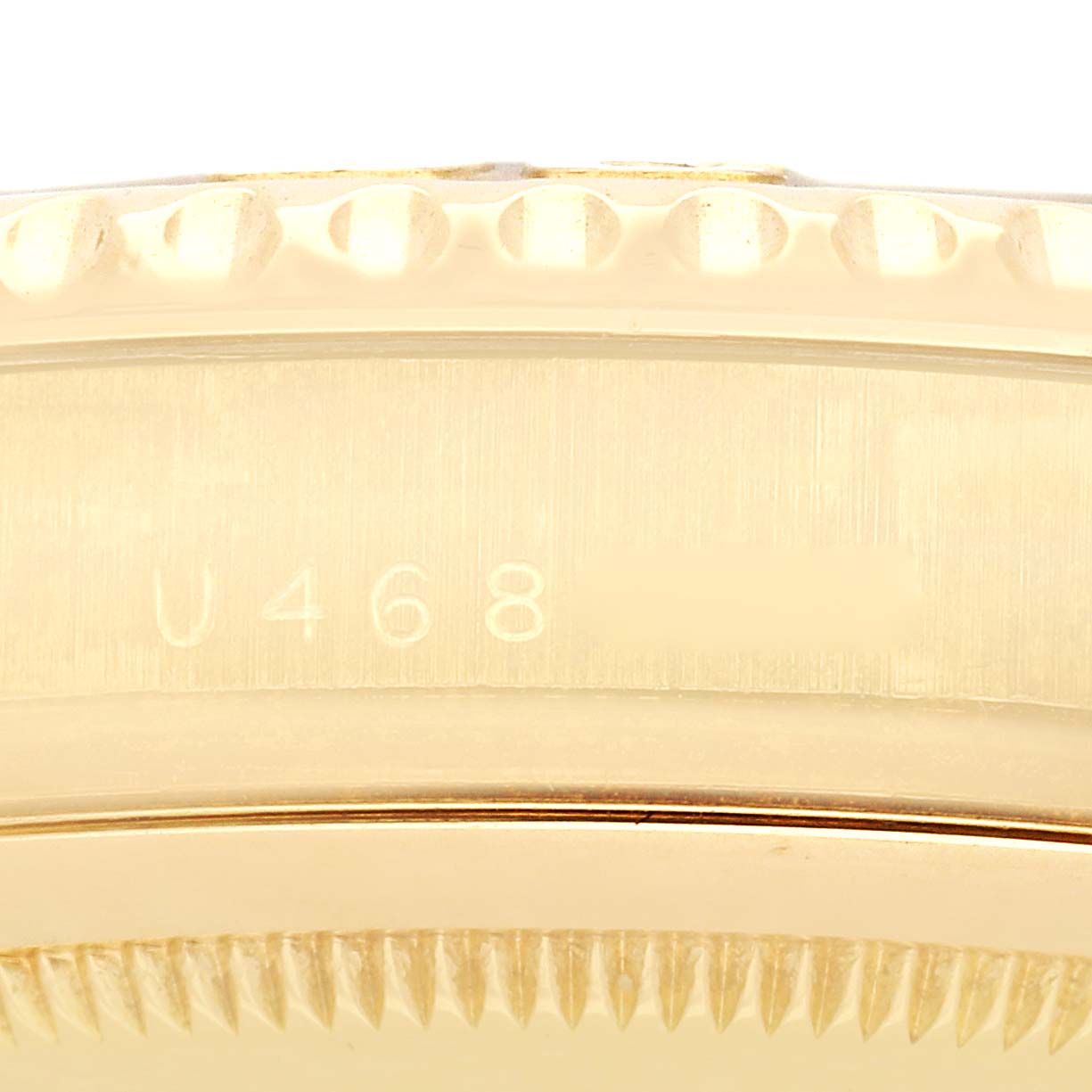 The image shows the side profile of a Rolex Yacht-Master 16628 Men
s Yellow Gold Mother of Pearl Dial 16628 Men
s Yellow Gold Mother of Pearl Dial
s case and bezel, highlighting the engraved details.