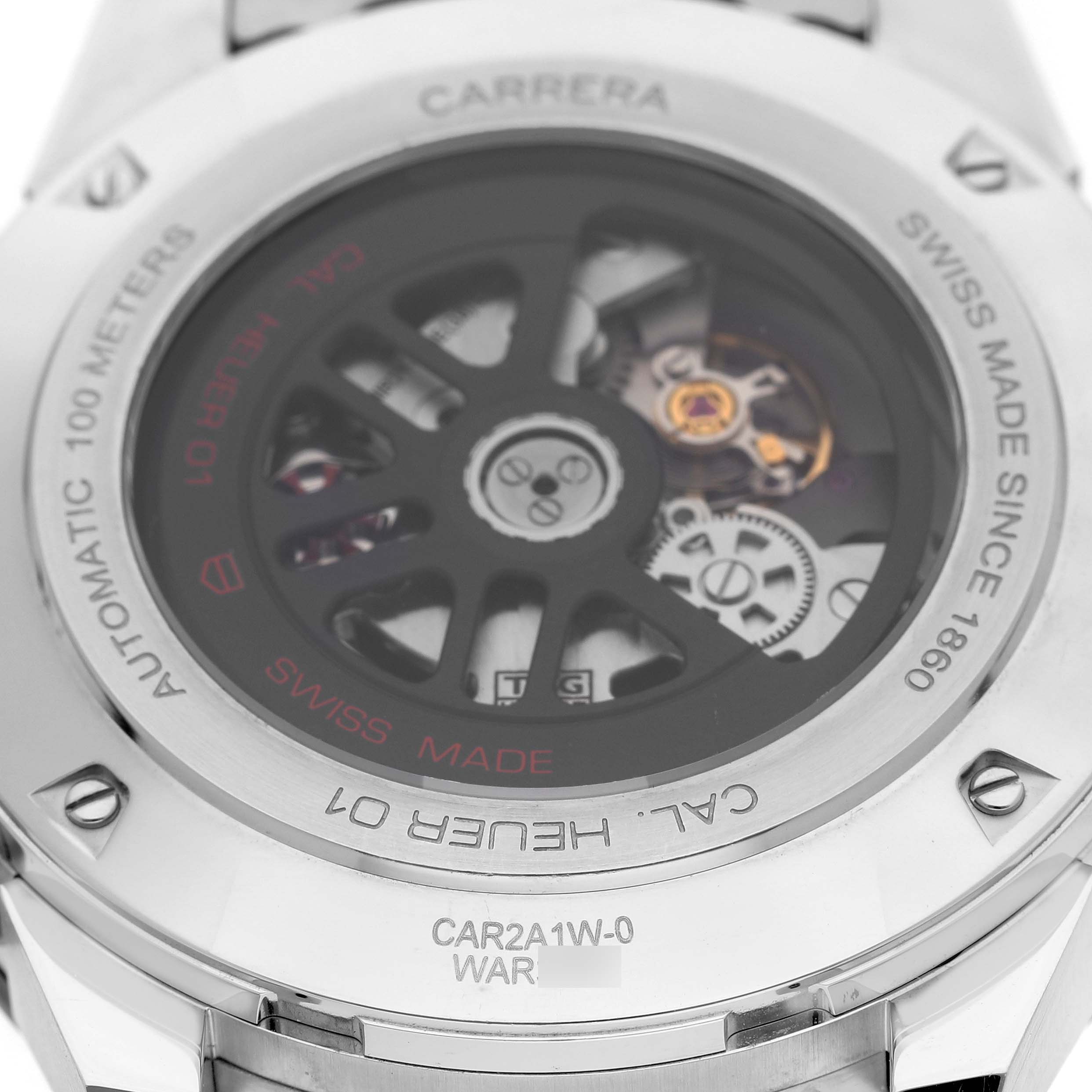 The image shows the back view of a Tag Heuer Carrera CAR2A1W.BA0703 Men's Stainless Steel Transparent Dial watch, displaying its exposed mechanical movement and engraved details.