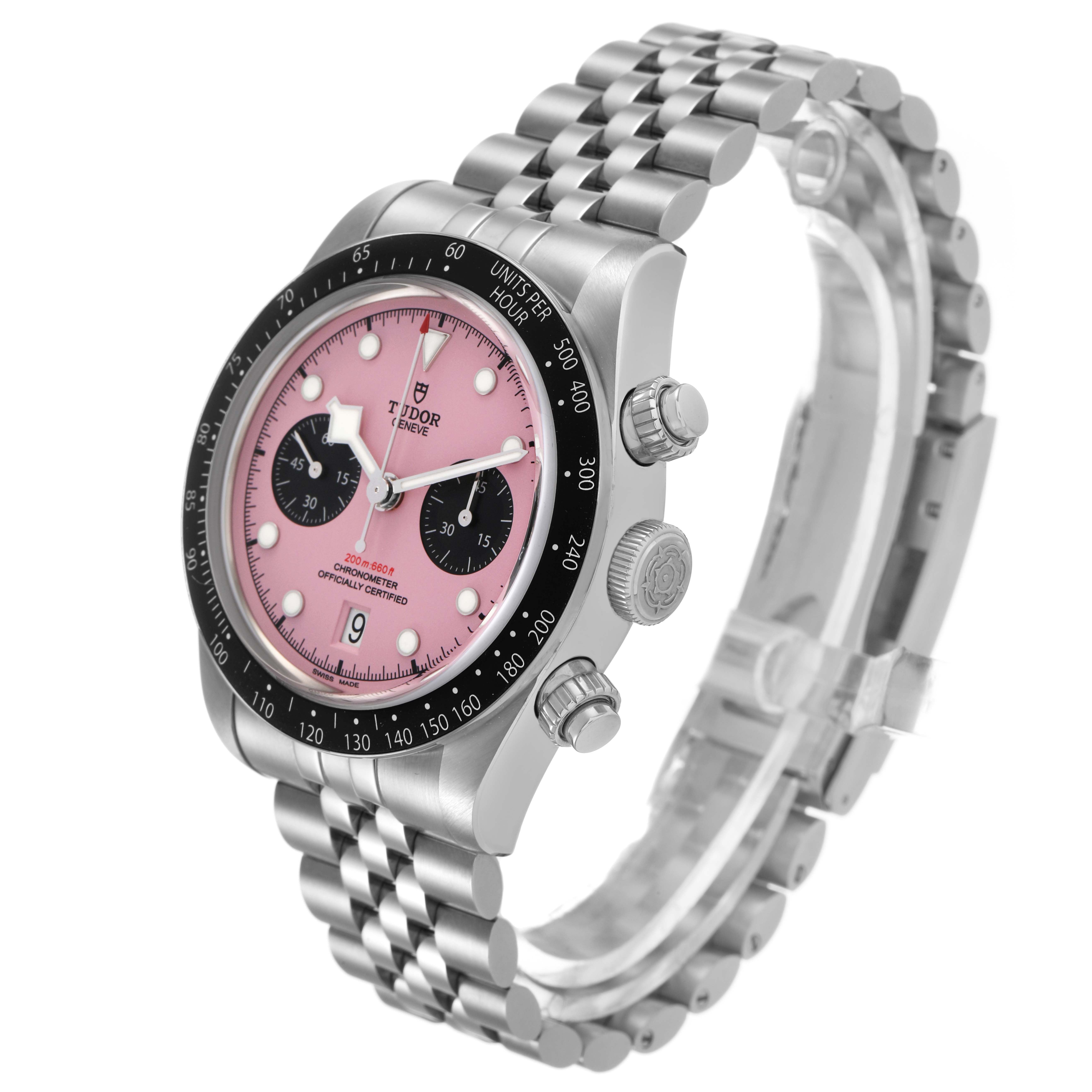 The Tudor Heritage Chrono M79360N-0019 Men's Stainless Steel Pink Dial watch is shown at a 3/4 angle, highlighting its dial, bezel, crown, and bracelet.