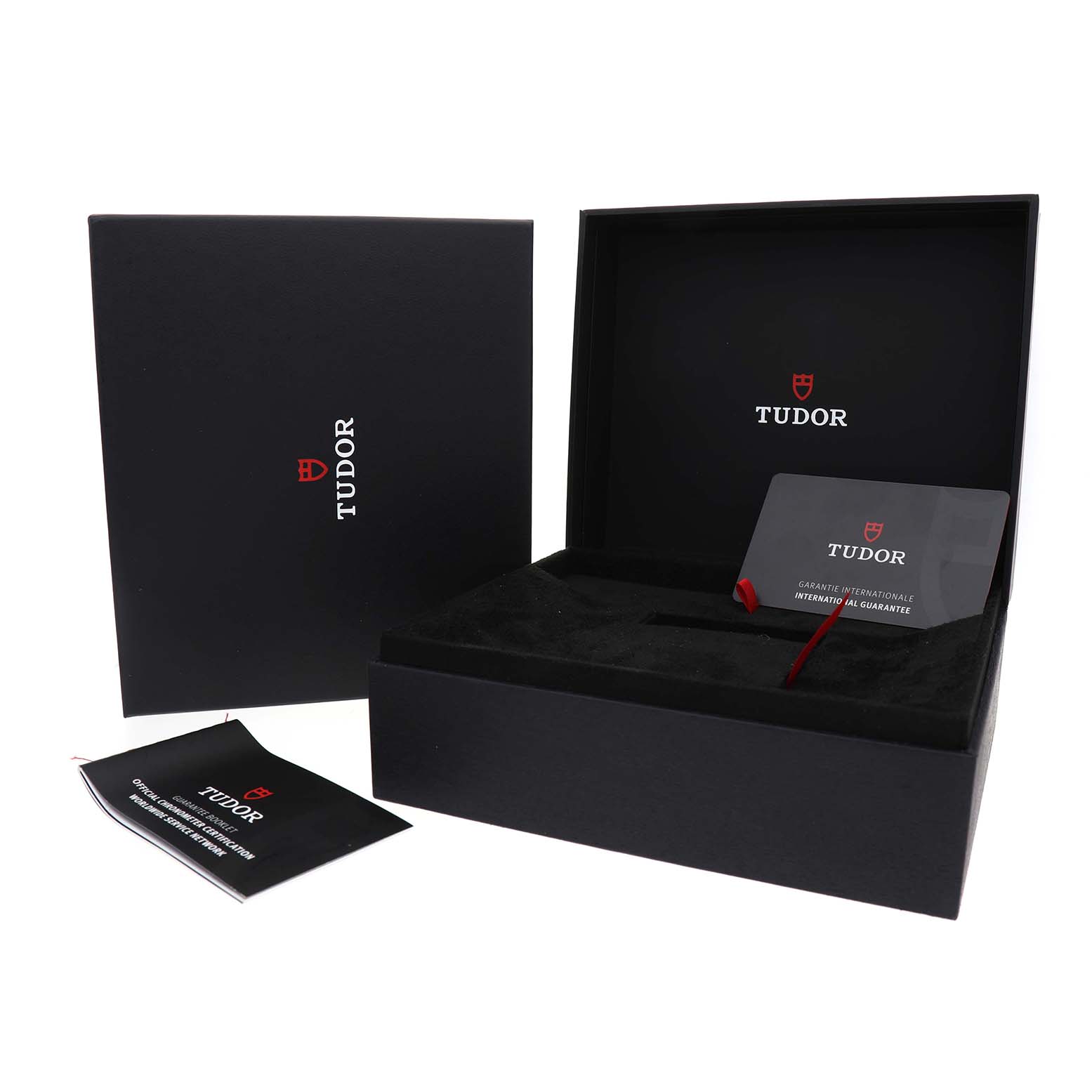 The image shows the packaging and guarantee card for the Tudor Heritage Chrono M79360N-0019 Men's Stainless Steel Pink Dial, including an outer box and instruction manual.