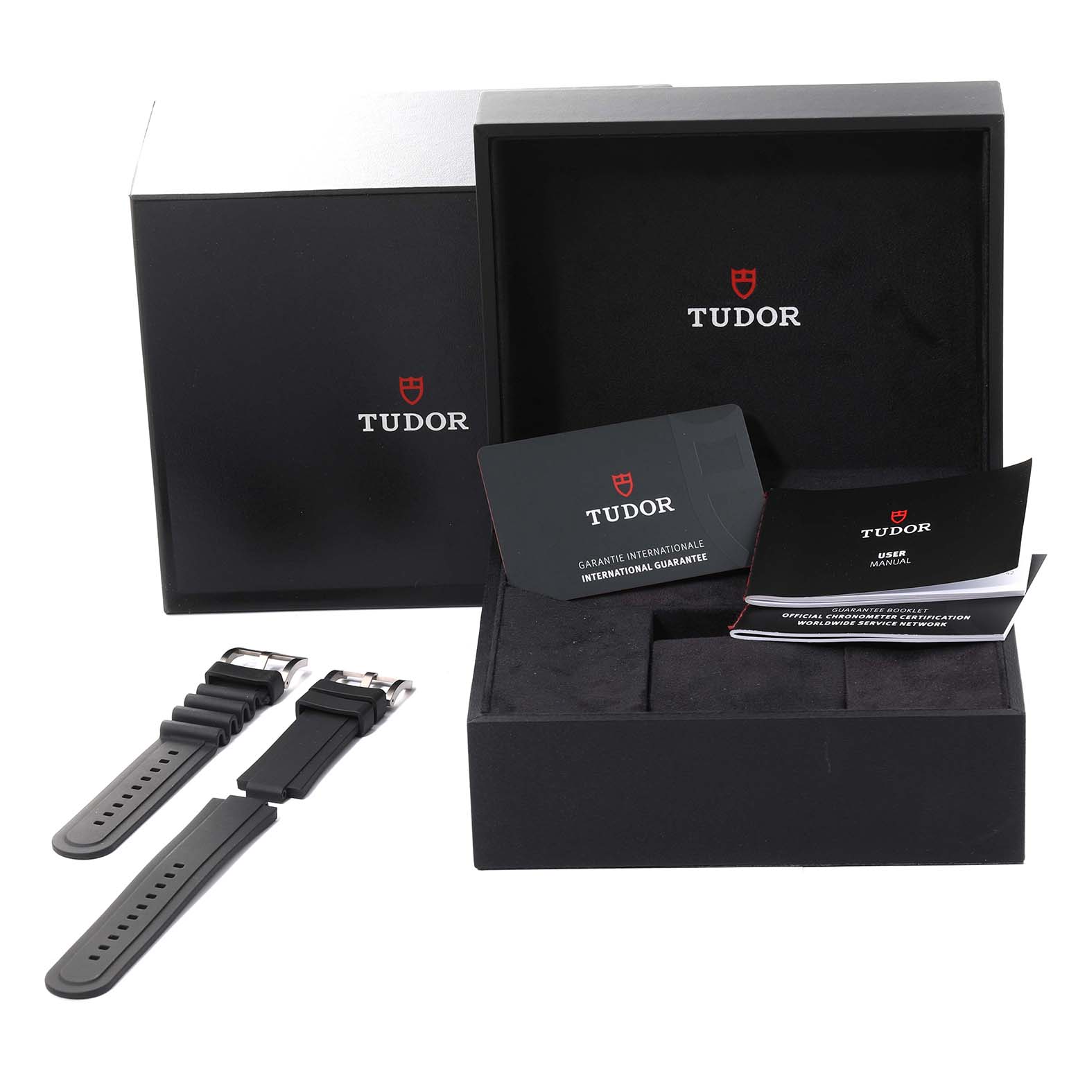The image shows the packaging, extra straps, and documentation for the Tudor Pelagos 25610TNL Men
s Stainless Steel Black Dial 25610TNL Men
s Stainless Steel Black Dial model watch.