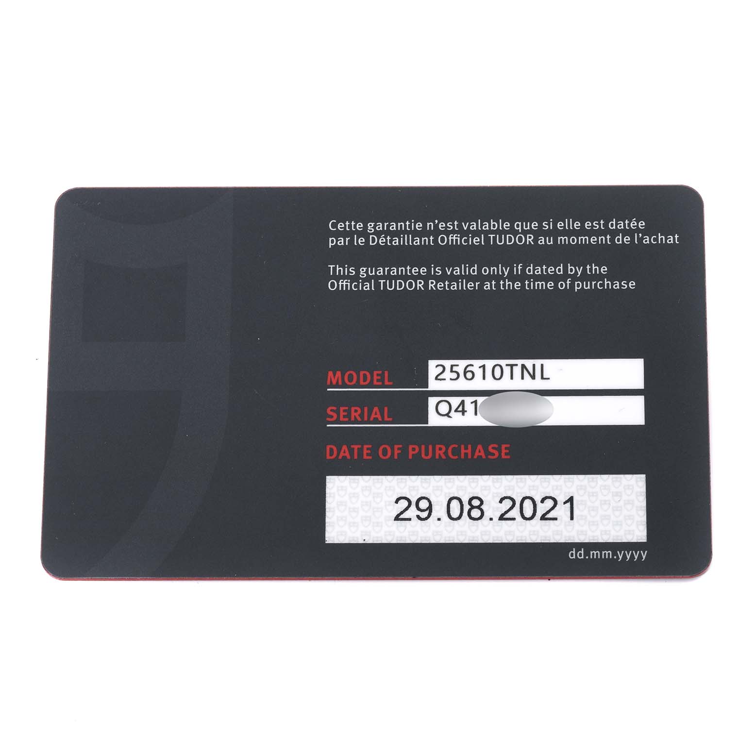 The image shows the warranty card for a Tudor Pelagos 25610TNL Men
s Stainless Steel Black Dial 25610TNL Men
s Stainless Steel Black Dial model watch, displaying the model number, serial number, and date of purchase.