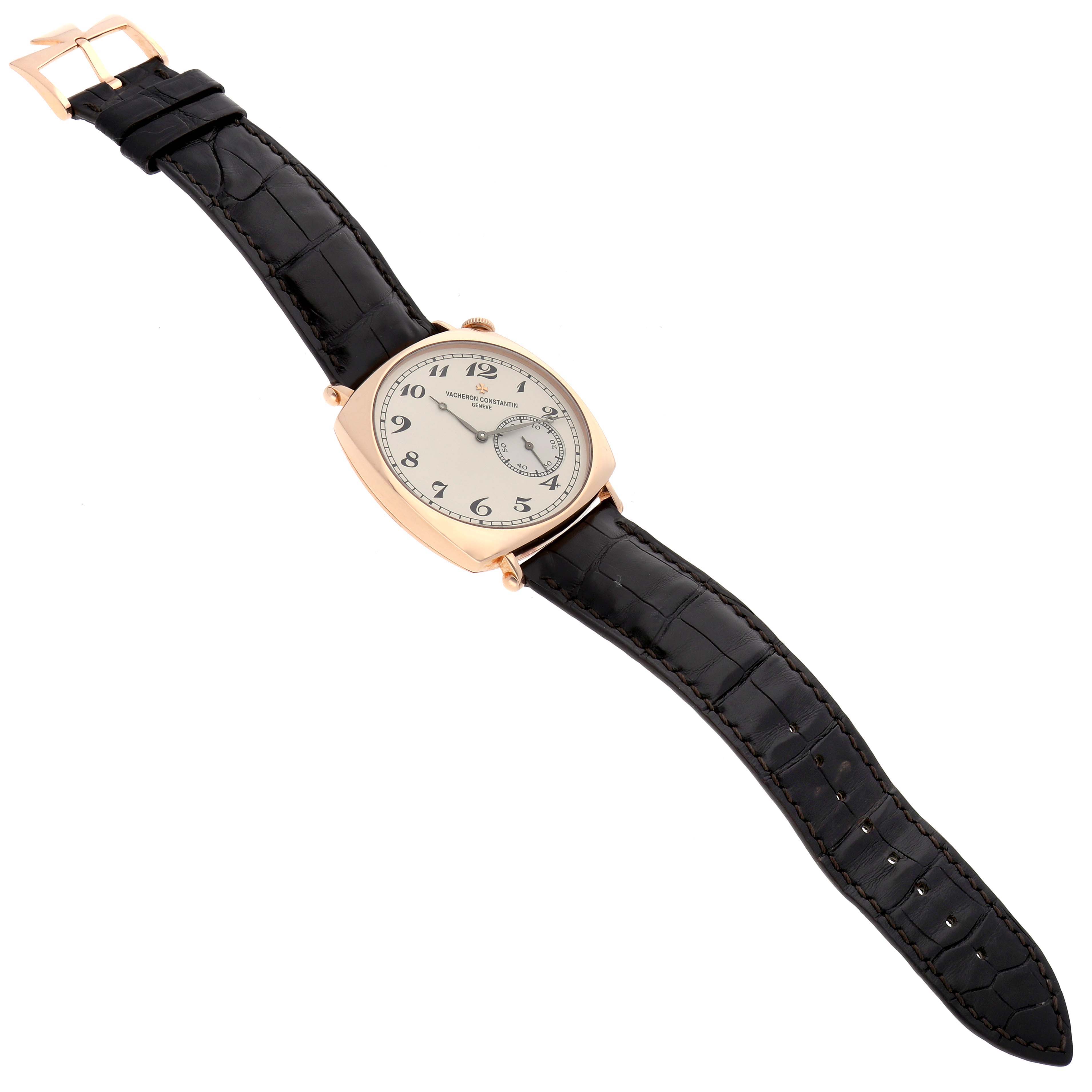 This Vacheron Constantin Historiques 82035/000R Men's Rose Gold Silver Dial 82035/000R Men's Rose Gold Silver Dial model watch is shown in a top-down angle, displaying its black leather strap, rose gold case, and dial.