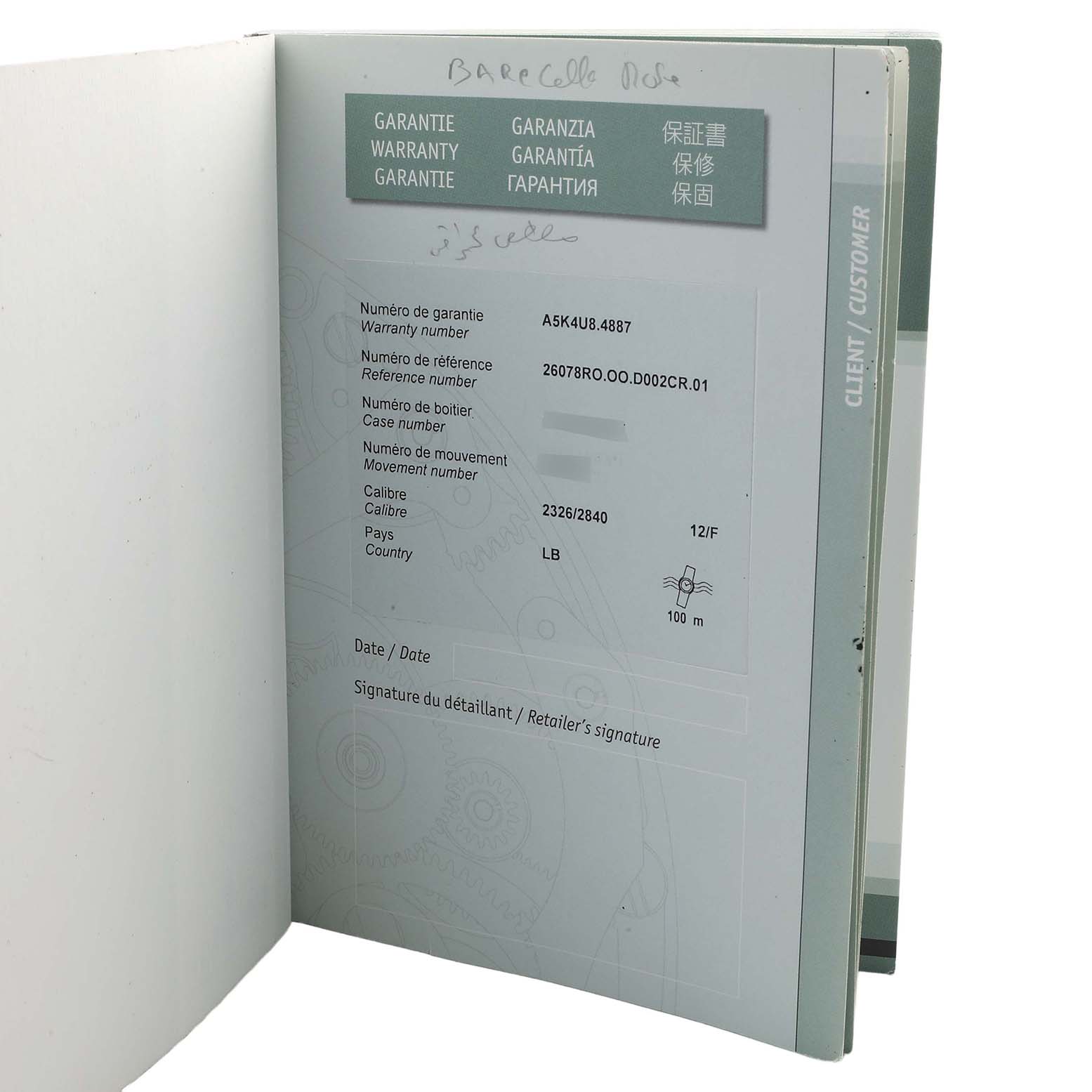 The image shows the warranty booklet for an Audemars Piguet Royal Oak Offshore 26078RO.00.D002CR.01 Men's Rose Gold White Dial, displaying warranty details and reference numbers.
