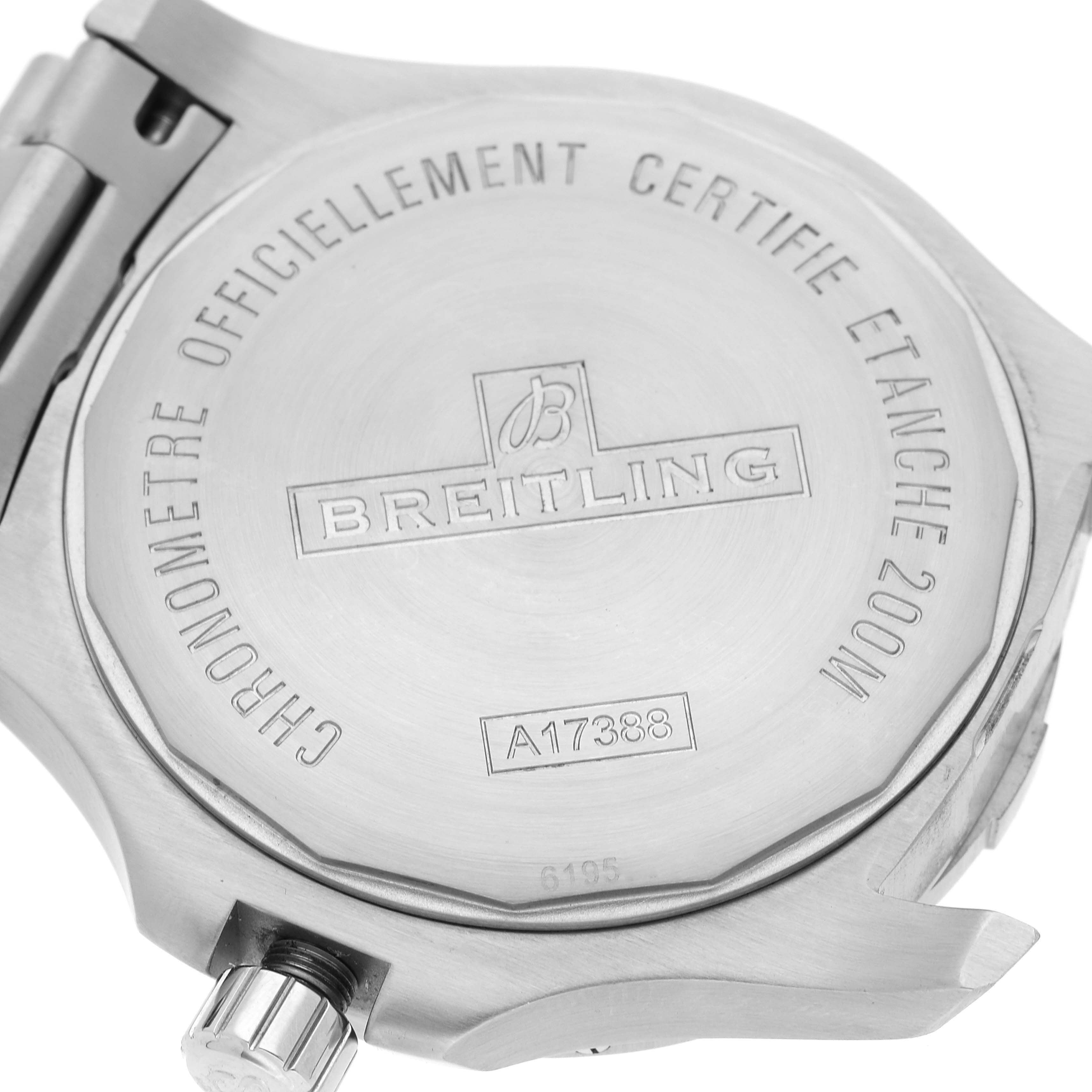 This image shows the back case of a Breitling Colt A17388 Men's Stainless Steel Black Dial A17388 Men's Stainless Steel Black Dial watch from an angled view, highlighting its engravings and crown.