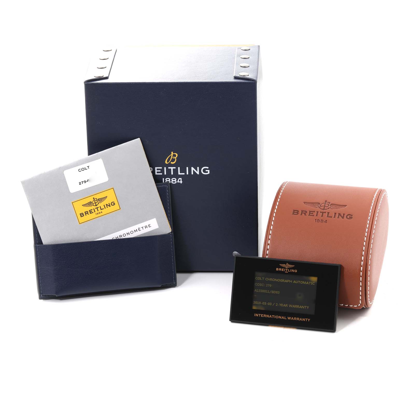The image shows the packaging, warranty card, and instruction manual for the Colt model by Breitling.