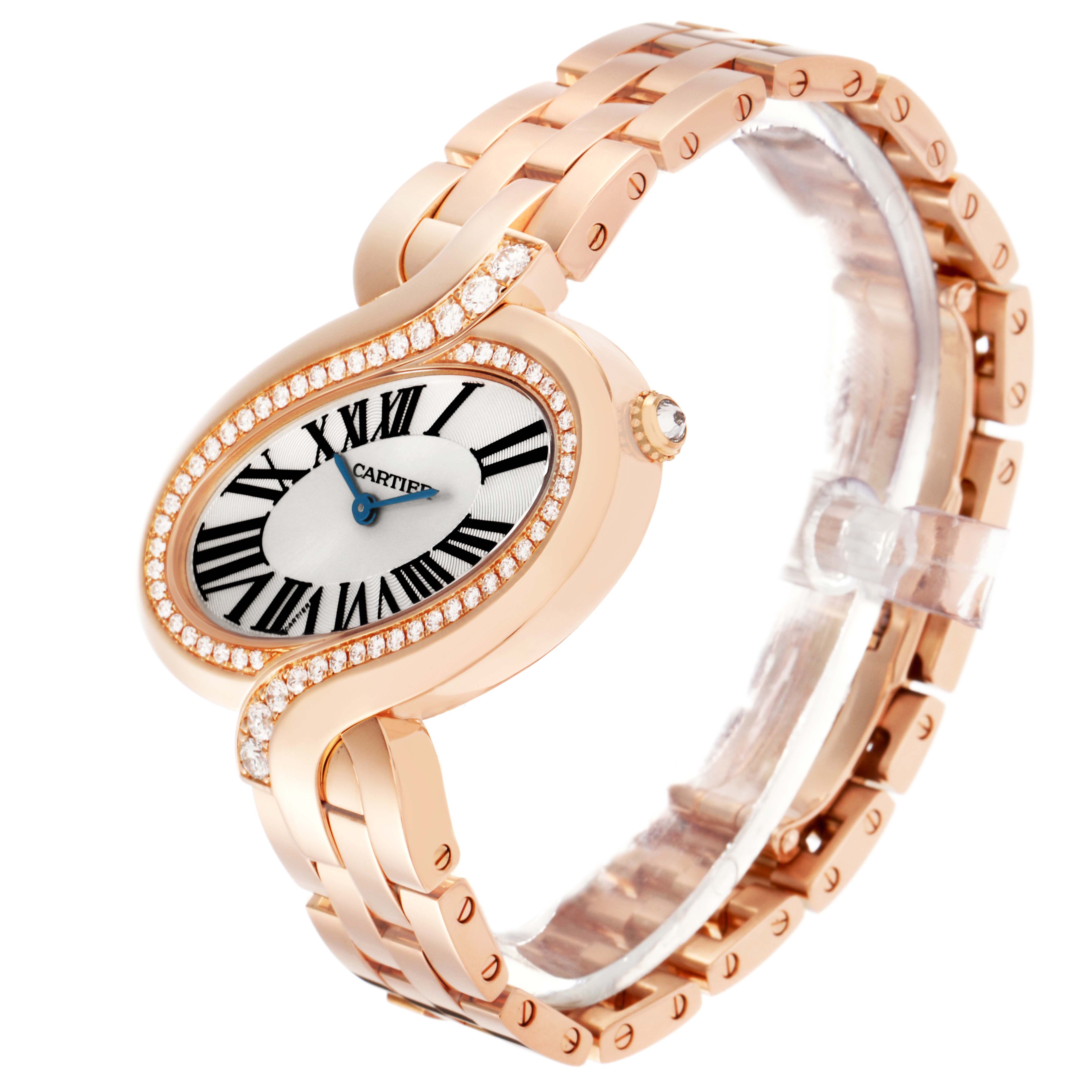 The Cartier Delices WG800006 Women
s Rose Gold Silver Dial WG800006 Women
s Rose Gold Silver Dial watch is shown at a three-quarter angle, highlighting its oval face, diamond bezel, and rose gold bracelet.