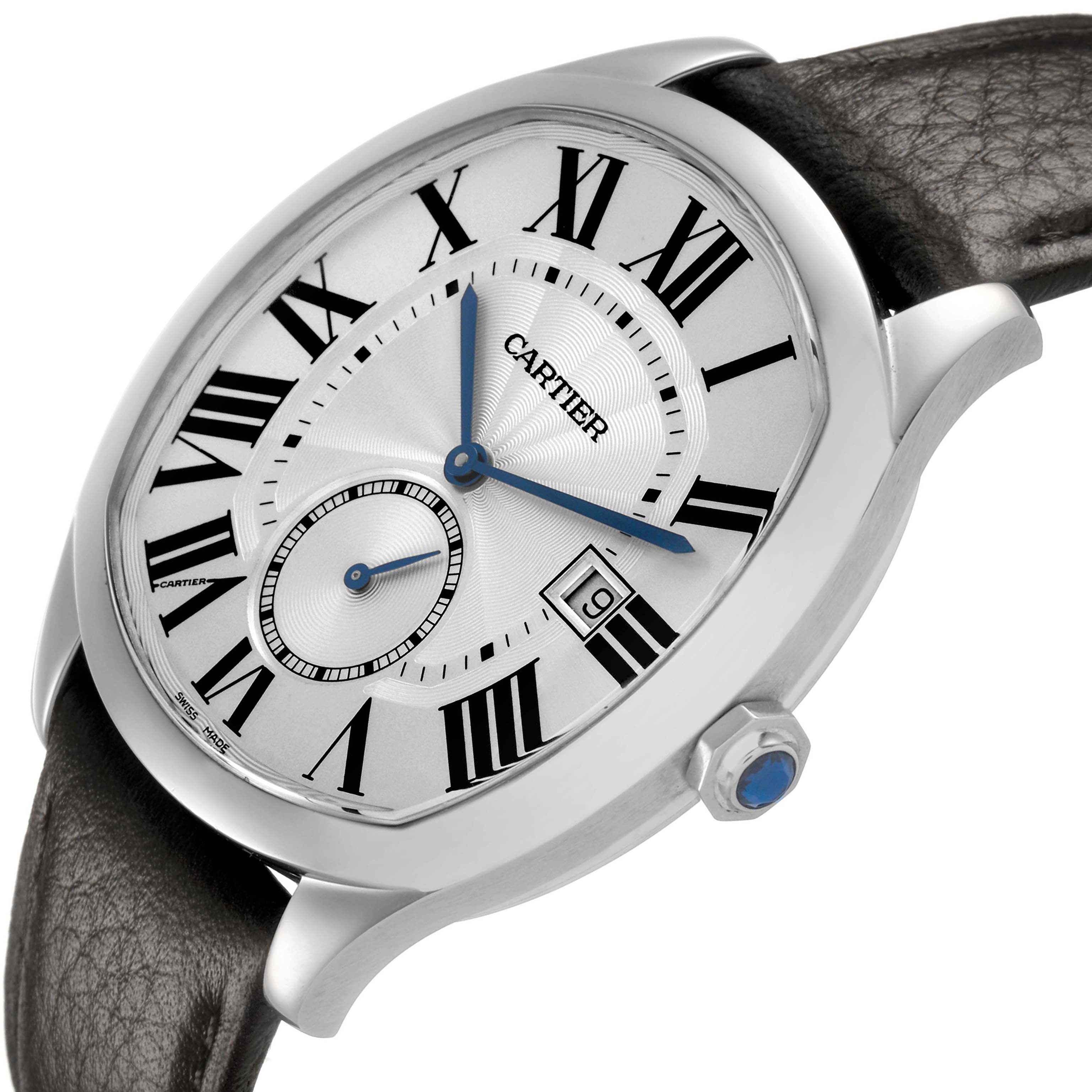The Drive de Cartier watch is shown at an angle highlighting the face, crown with a blue cabochon, and strap attachment.