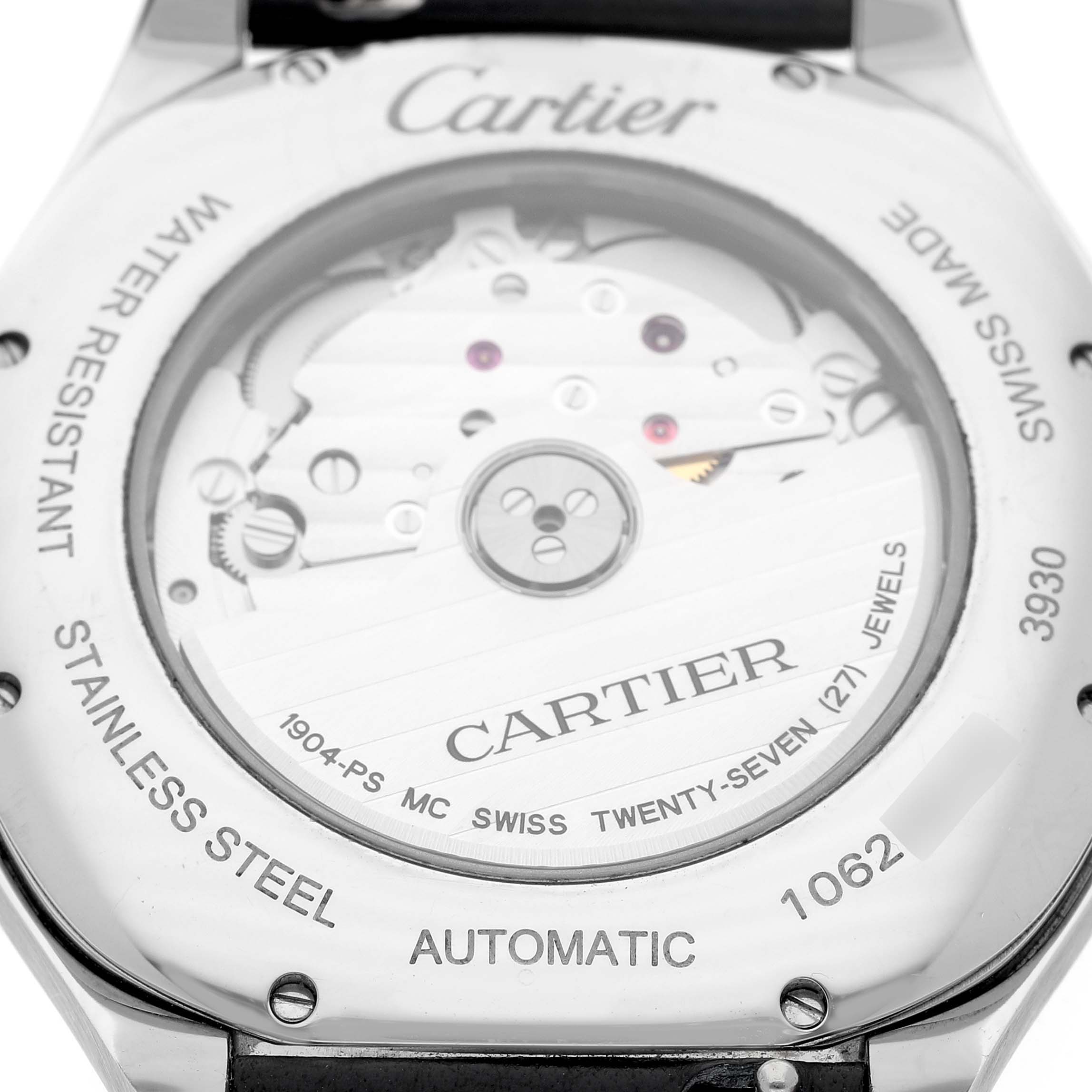The image shows the back view of a Drive de Cartier watch, highlighting its automatic movement and stainless steel case.