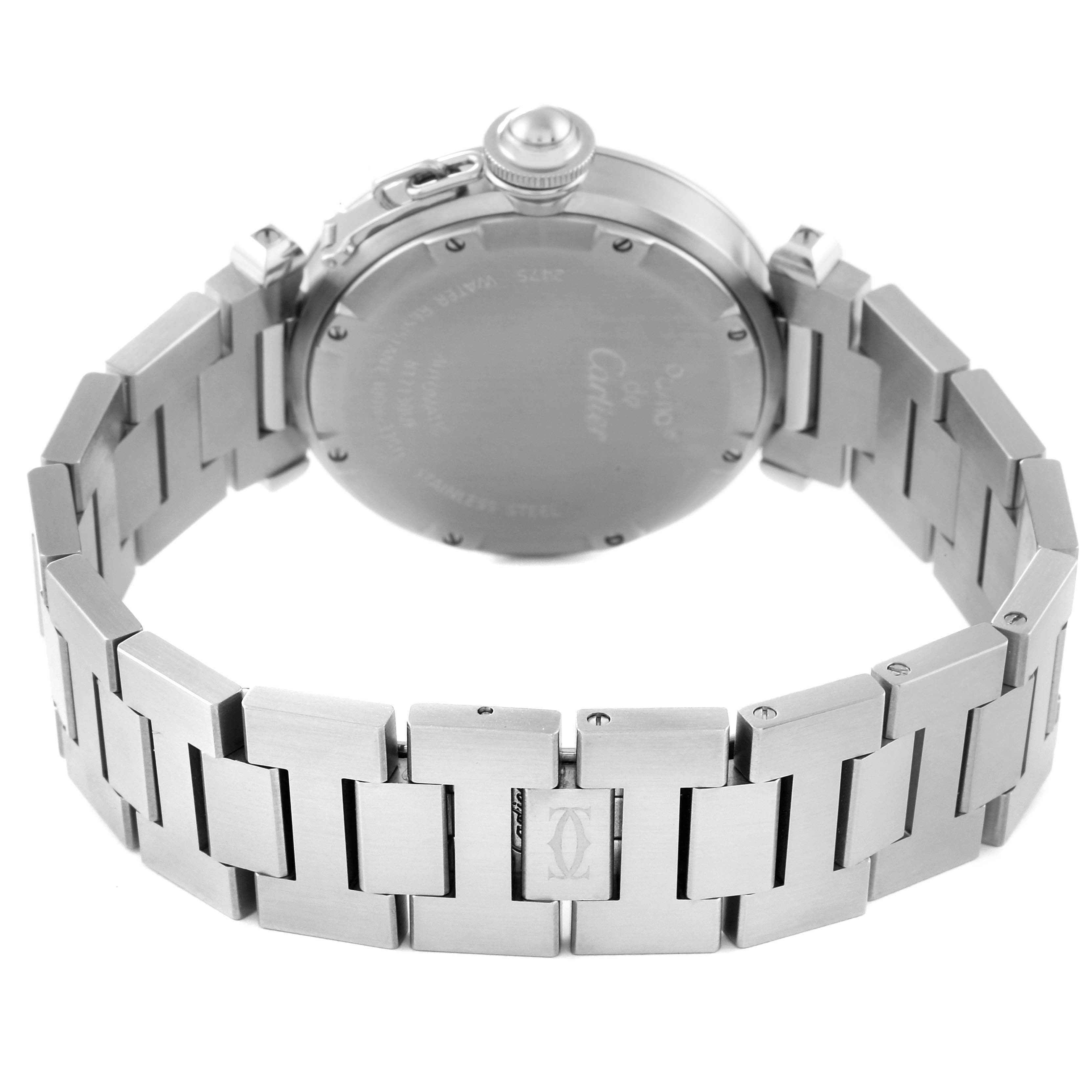 The image shows the back view of the Pasha model by Cartier, highlighting its case back and bracelet.