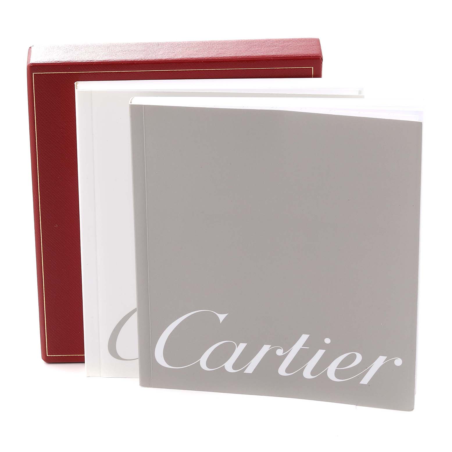 The image shows the Cartier Pasha W31058M7 Women's Stainless Steel Pink Dial W31058M7 Women's Stainless Steel Pink Dial watch manuals in white and grey, along with a red Cartier box in the background.