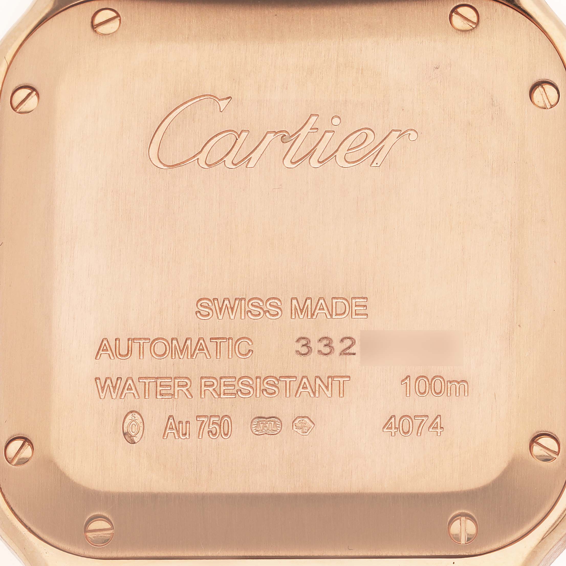 This image shows the back case of a Cartier Santos WJSA0007 Men's Rose Gold Silver Dial WJSA0007 Men's Rose Gold Silver Dial watch, highlighting its engravings and screws.