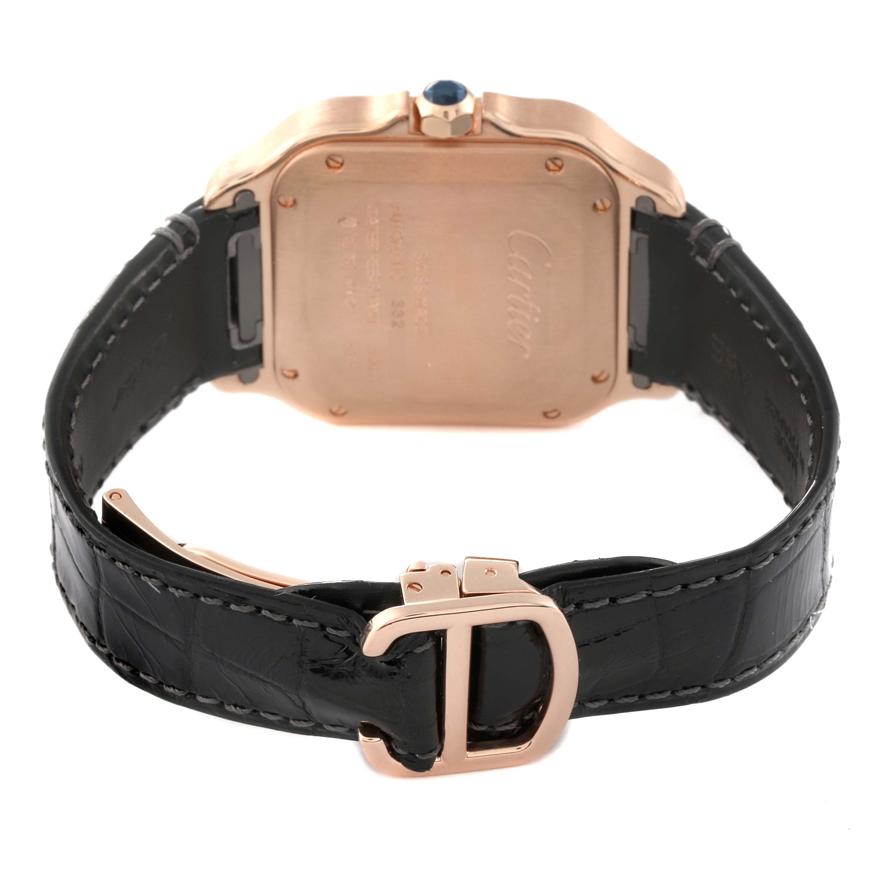 The image shows the back case and strap of a Santos by Cartier watch, featuring a black leather band and a gold buckle.