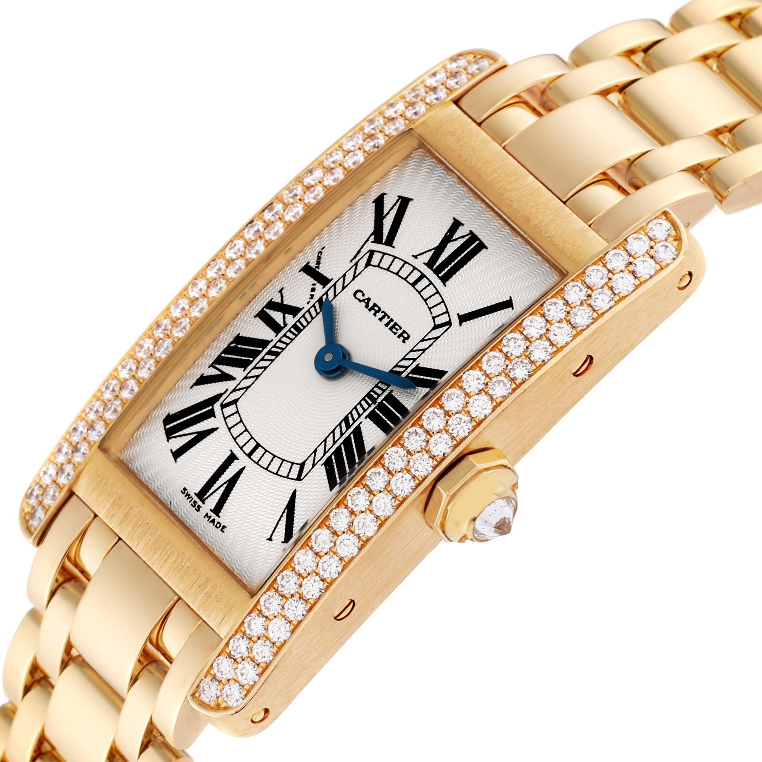 The image shows a close-up angled view of the Cartier Tank Americaine WB7012K2 Women's Yellow Gold Silver Dial WB7012K2 Women's Yellow Gold Silver Dial watch, highlighting its dial, diamond bezel, and gold bracelet.