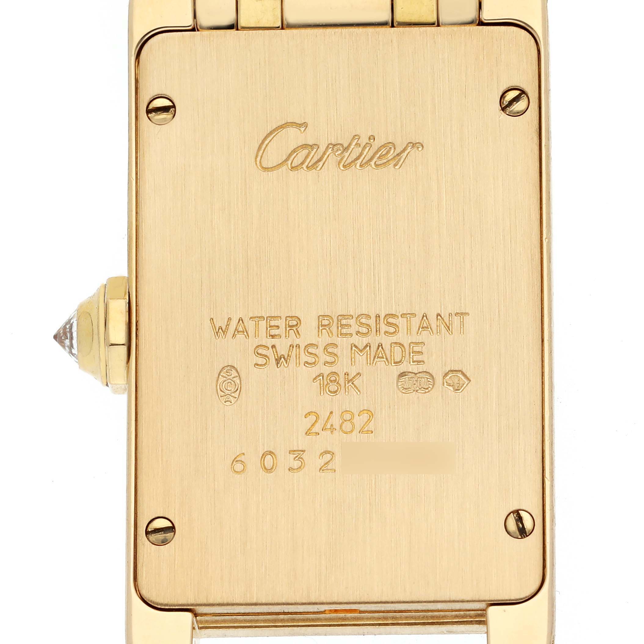 The image shows the back case of a Cartier Tank Americaine WB7012K2 Women's Yellow Gold Silver Dial WB7012K2 Women's Yellow Gold Silver Dial watch, highlighting its water resistance, Swiss origin, and 18K gold markings.