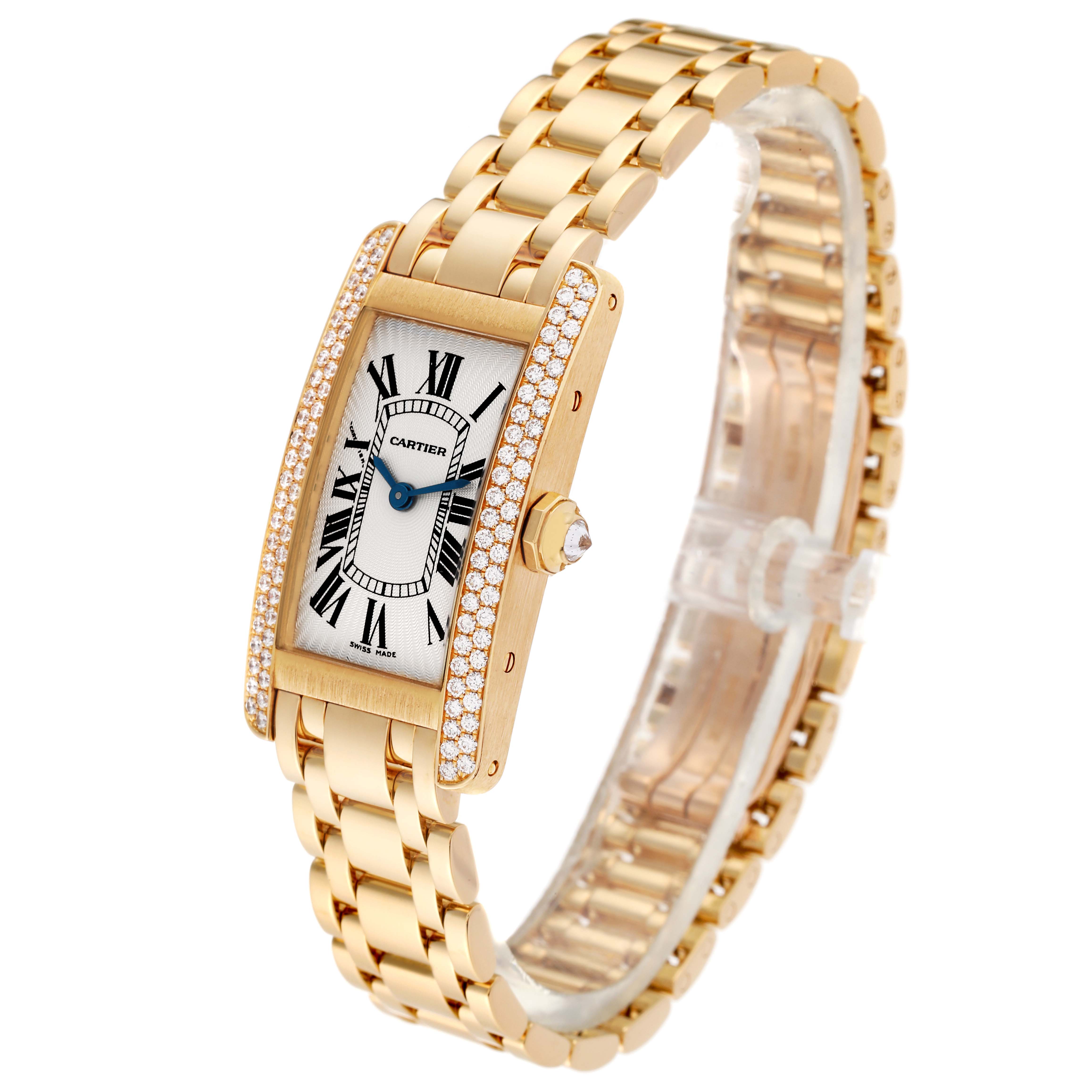 The image shows a Cartier Tank Americaine WB7012K2 Women's Yellow Gold Silver Dial WB7012K2 Women's Yellow Gold Silver Dial watch angled slightly to the right, highlighting the watch face, crown, and gold bracelet.