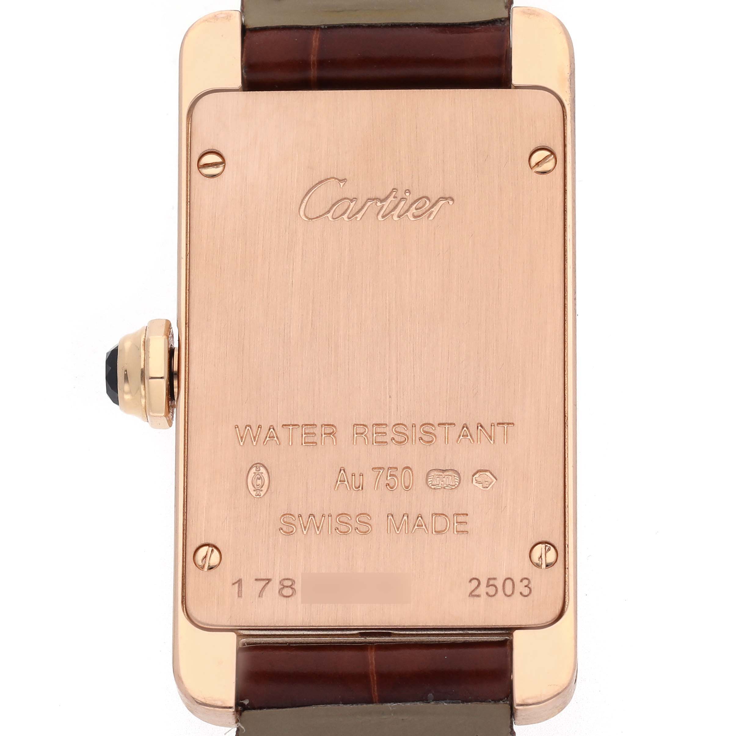 The image shows the back of a Cartier Tank Americaine W2607456 Women's Rose Gold Silver Dial W2607456 Women's Rose Gold Silver Dial watch, featuring inscriptions and a leather strap.