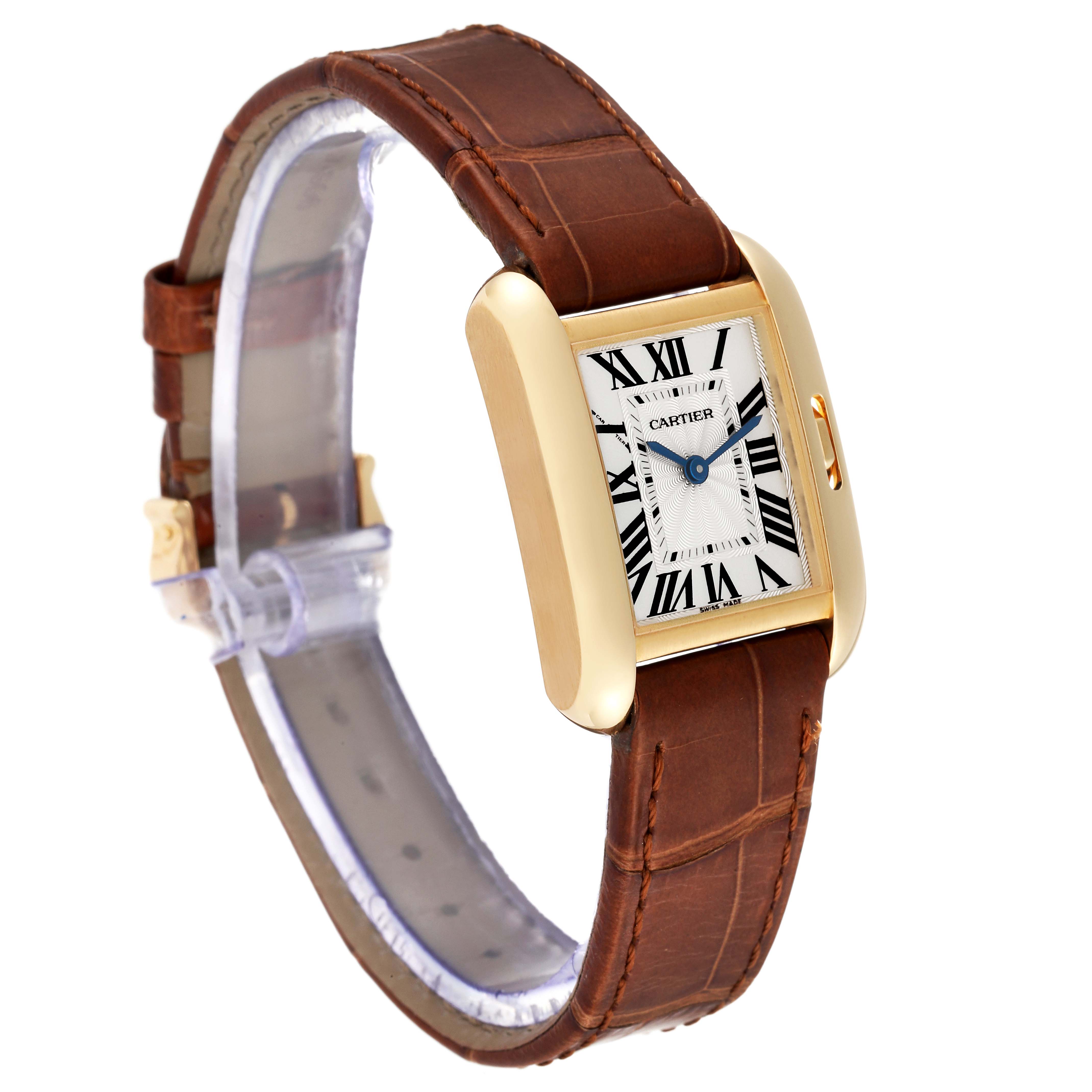 The image shows a Cartier Tank Anglaise W5310028 Women
s Yellow Gold Silver Dial W5310028 Women
s Yellow Gold Silver Dial watch featuring a gold rectangular case, a white dial with Roman numerals, and a brown leather strap, at a slight angle.