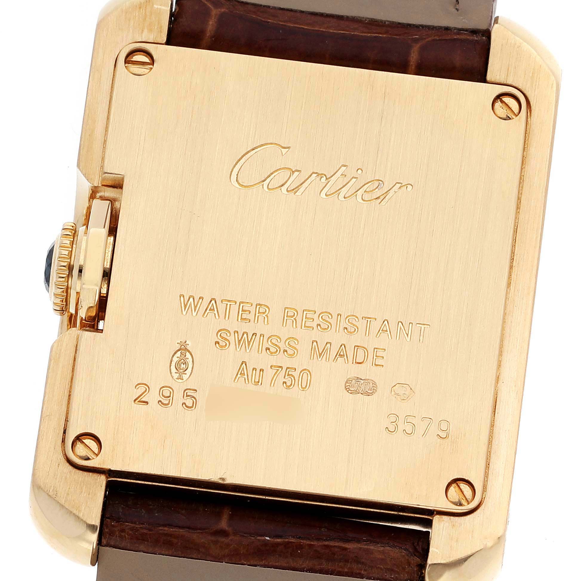 The image shows the back case of the Cartier Tank Anglaise W5310028 Women
s Yellow Gold Silver Dial W5310028 Women
s Yellow Gold Silver Dial watch, highlighting the brand engraving and certification details.