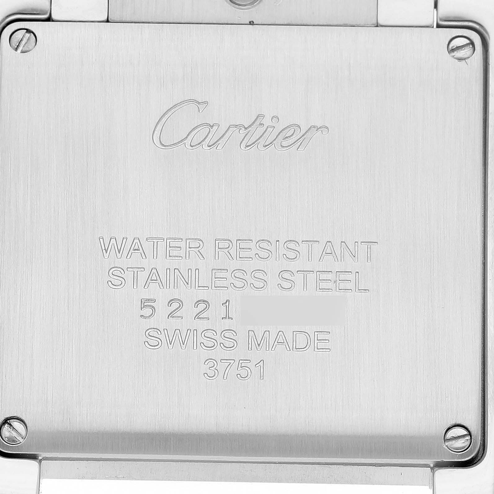 The image shows the stainless steel case back of a Cartier Tank Francaise W4TA0009 Women's Stainless Steel Silver Dial watch with engraved details.