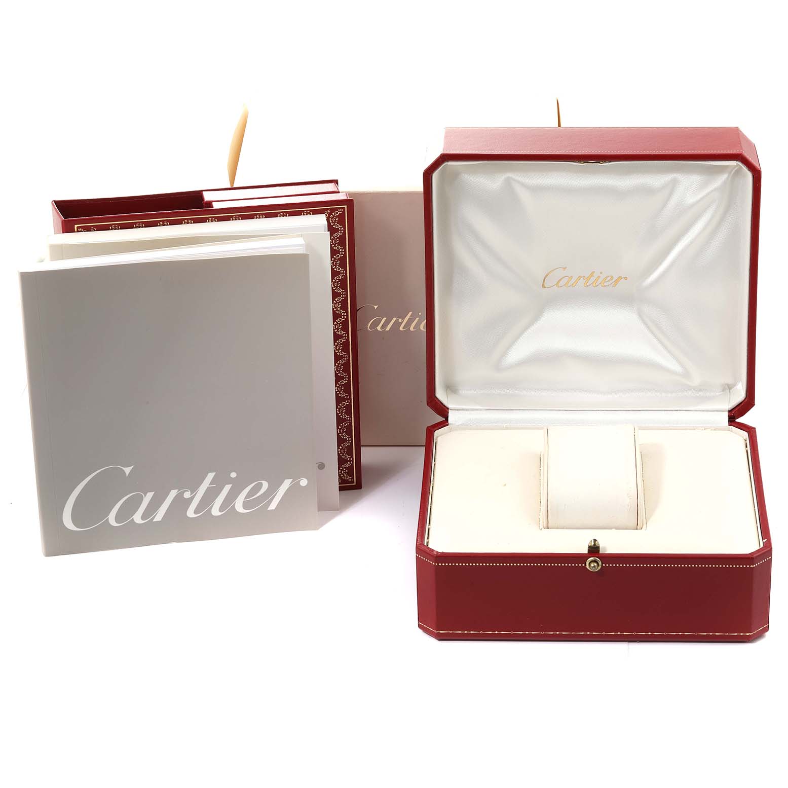 The image shows the packaging and accessories of a Cartier Tank Francaise W51011Q3 Women
s Stainless Steel Silver Dial W51011Q3 Women
s Stainless Steel Silver Dial model watch, including a red box and accompanying booklets.
