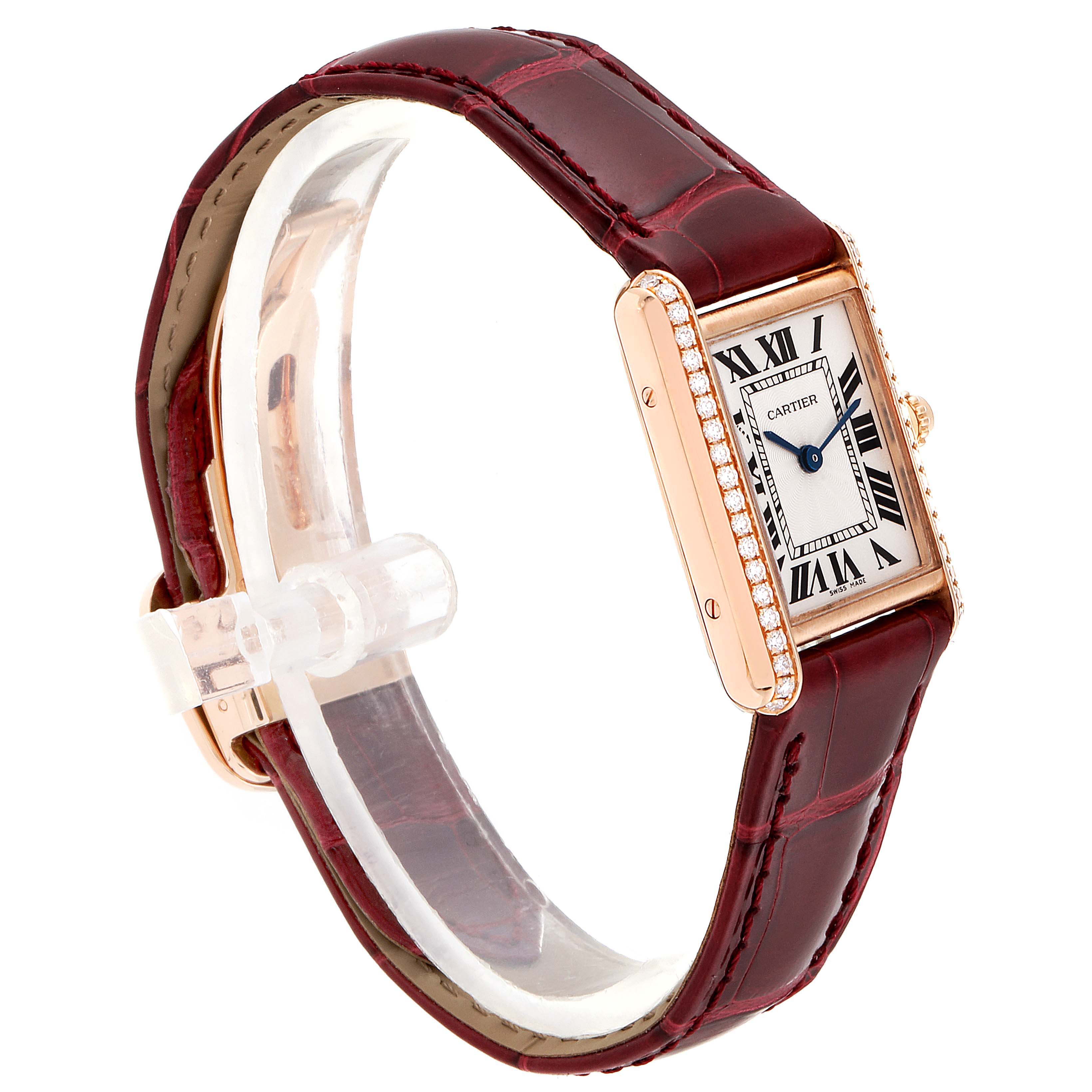 The image shows a side angle of the Cartier Tank Louis WJTA0010 Women's Yellow Gold Silver Dial WJTA0010 Women's Yellow Gold Silver Dial watch, featuring a red leather strap and diamond-studded bezel.