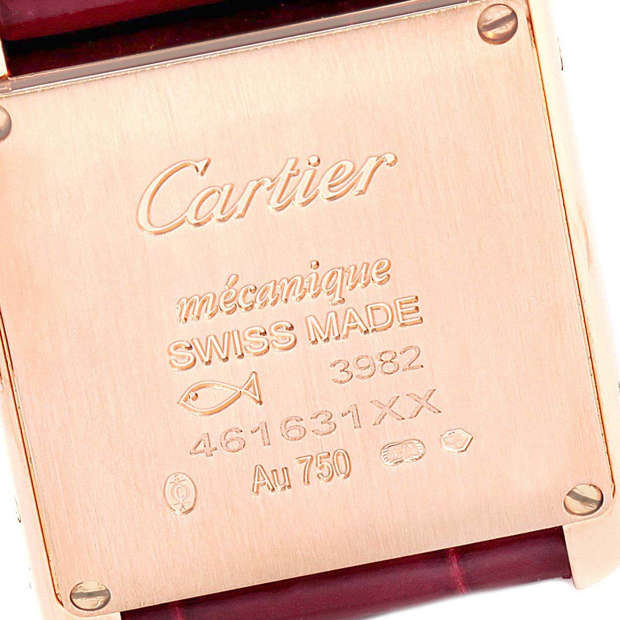 The image shows the back case of a Cartier Tank Louis WJTA0010 Women's Yellow Gold Silver Dial WJTA0010 Women's Yellow Gold Silver Dial watch, detailing inscriptions and screws at the corners.