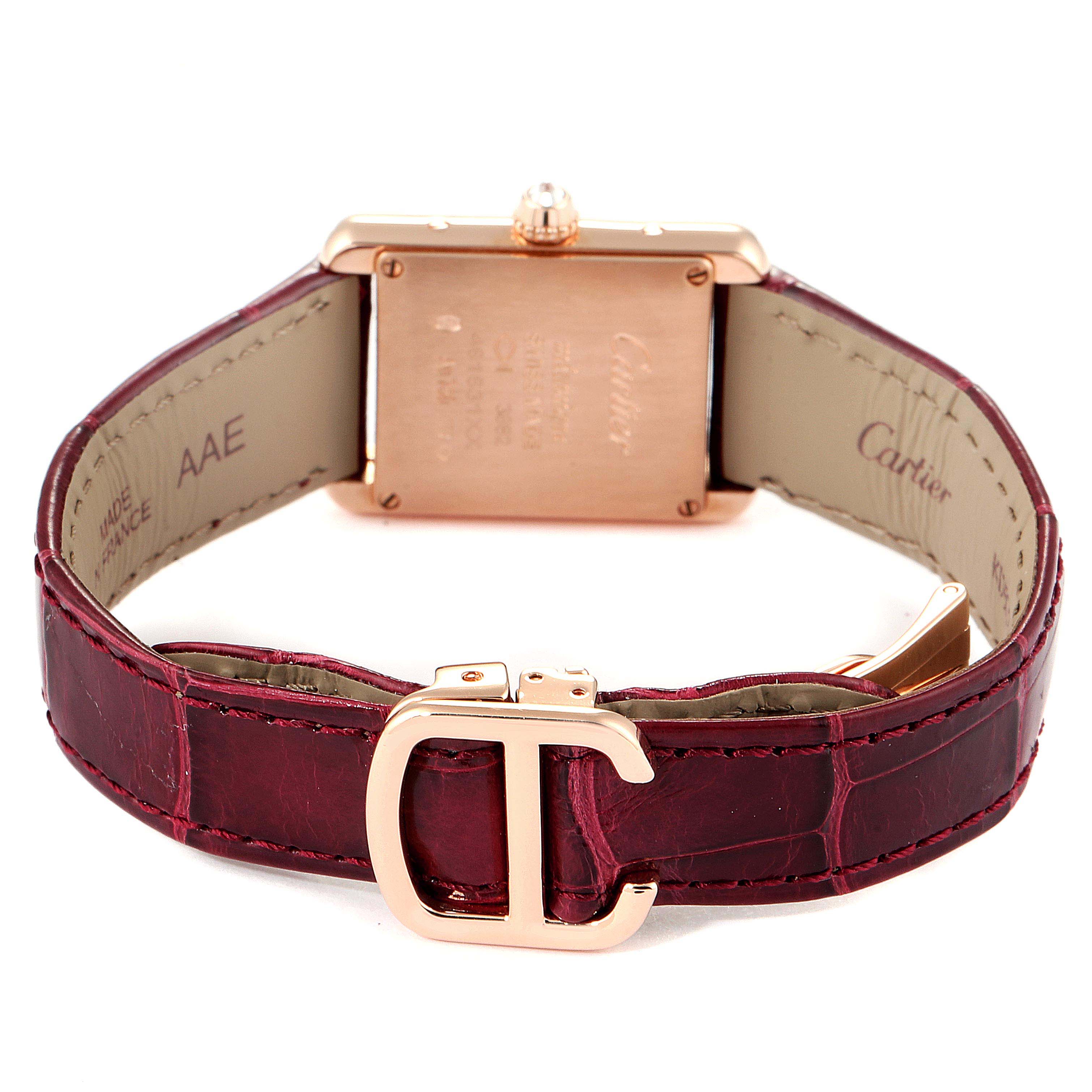 The image shows a Cartier Tank Louis WJTA0010 Women's Yellow Gold Silver Dial WJTA0010 Women's Yellow Gold Silver Dial model watch from the back, highlighting the case, crown, and leather strap with a signature buckle.