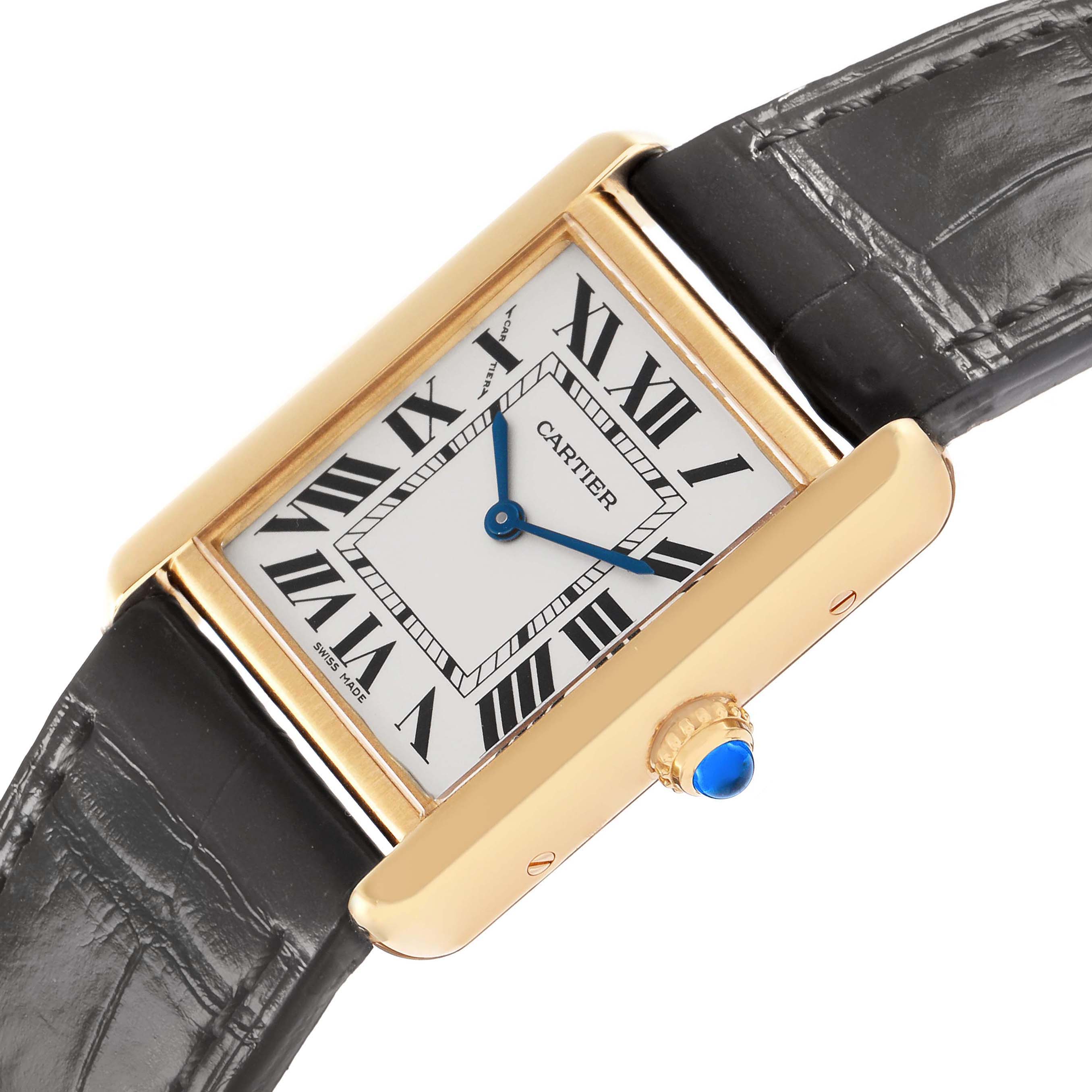 The Cartier Tank Solo model W5200002 watch is shown at an angled view, featuring its rectangular face, Roman numerals, and blue hands, with part of the leather strap visible.