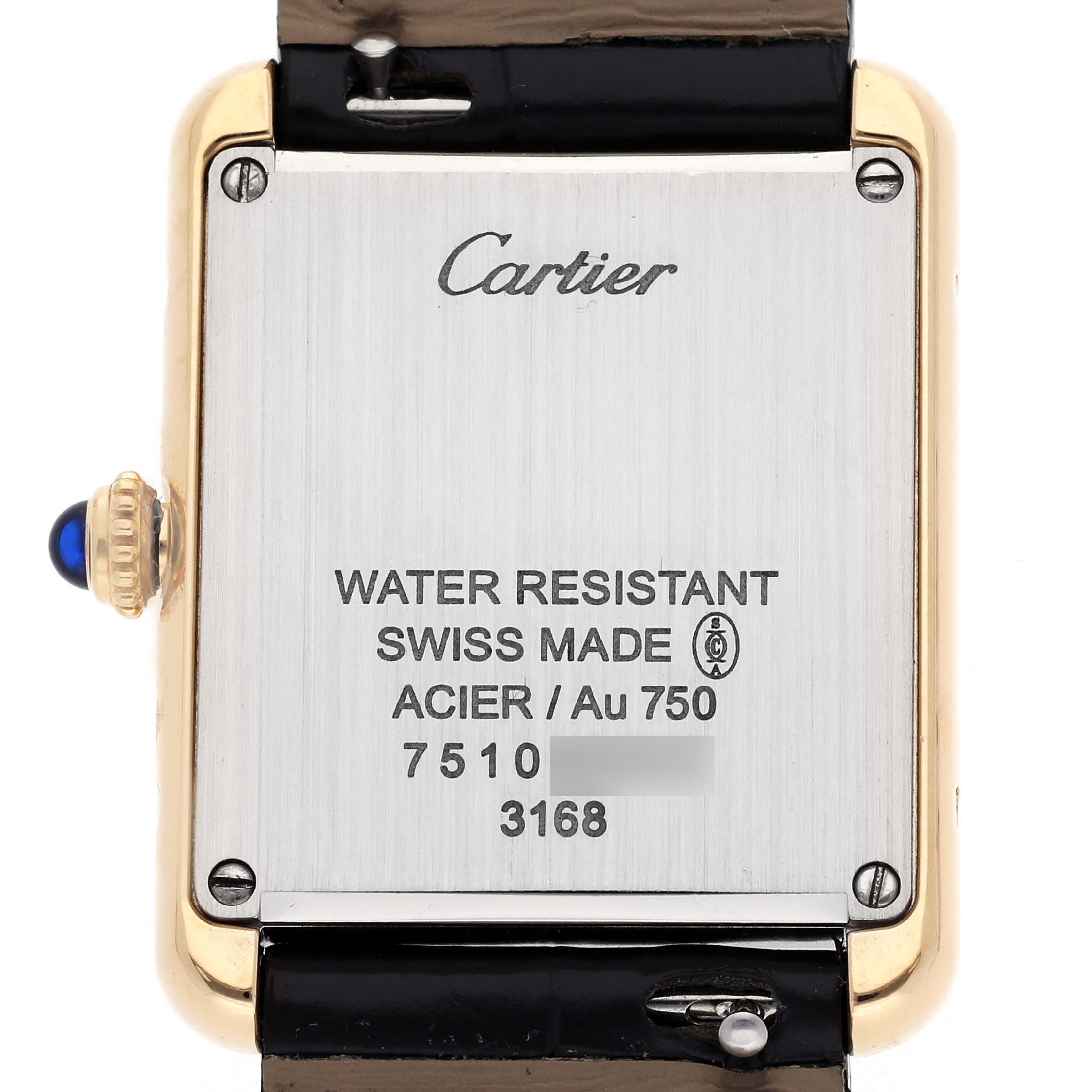 The image shows the back of the Cartier Tank Solo W5200024 Women
s Steel and Gold (two tone) Silver Dial W5200024 Women
s Steel and Gold (two tone) Silver Dial watch, highlighting its inscriptions and side crown.