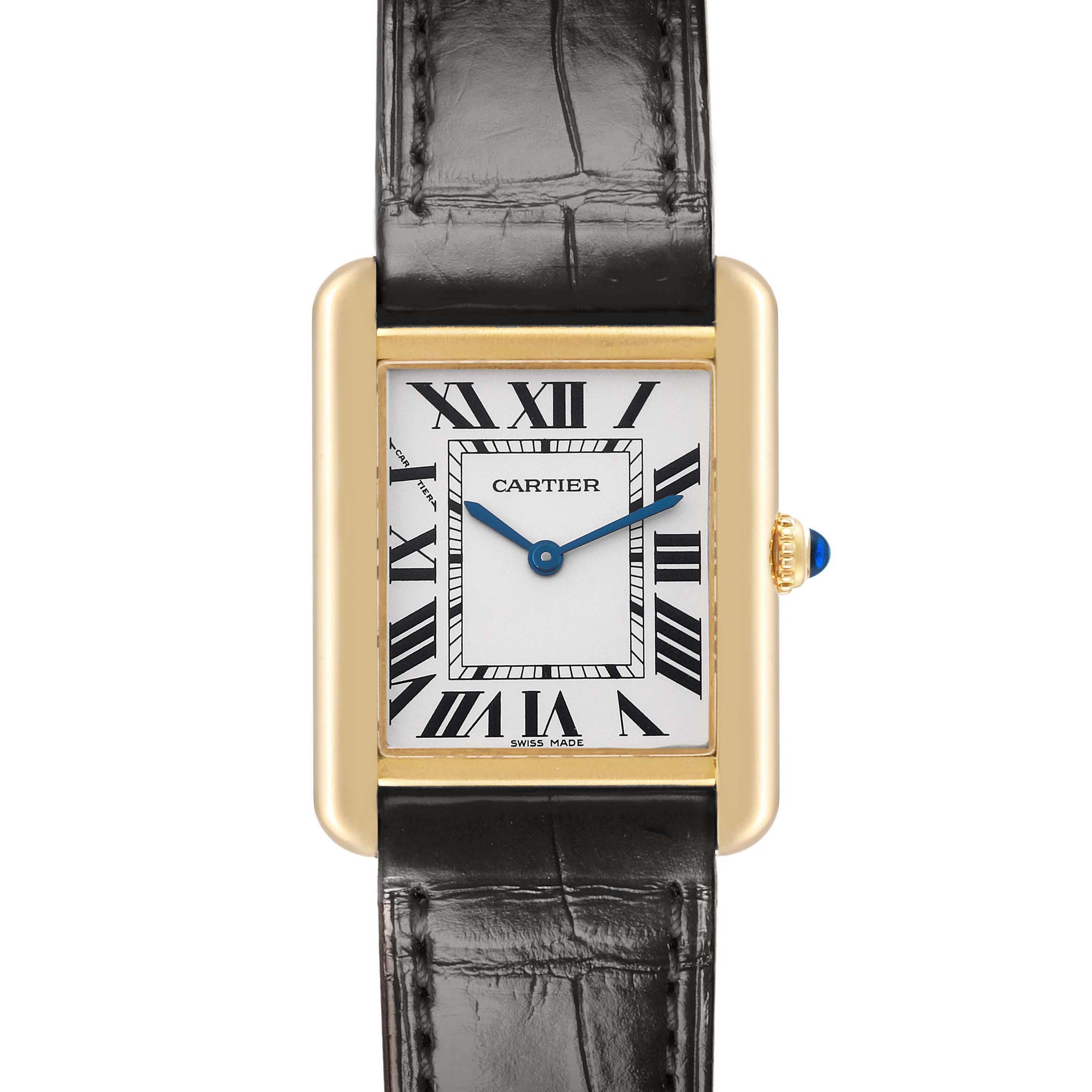 The image shows a Cartier Tank Solo, model W5200002, from the front, displaying the face, Roman numerals, hands, case, crown with a blue cabochon, and black leather strap.