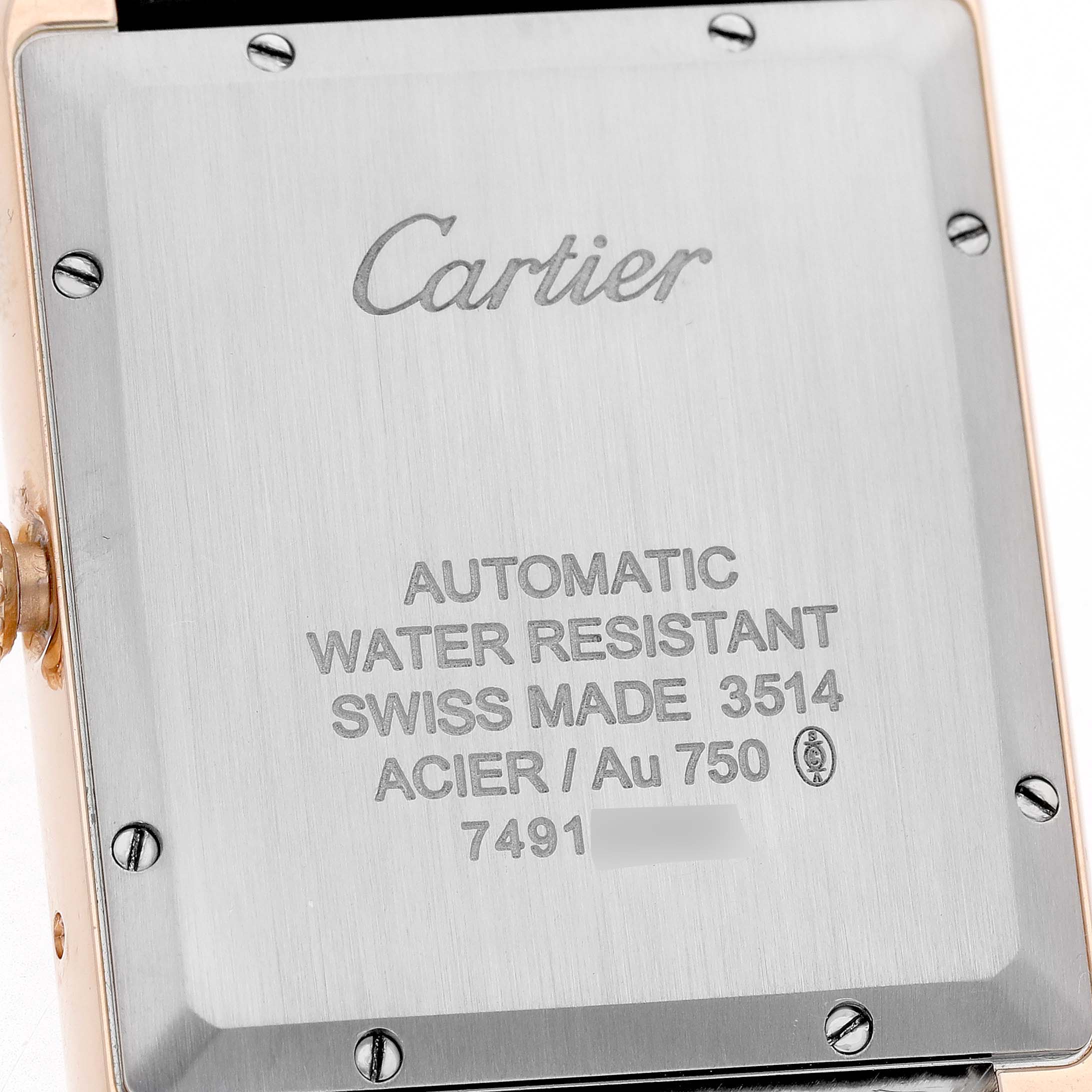 The image shows the back case of the Cartier Tank Solo W5200026 Men's Rose Gold Silver Dial watch, highlighting the engravings and screws.