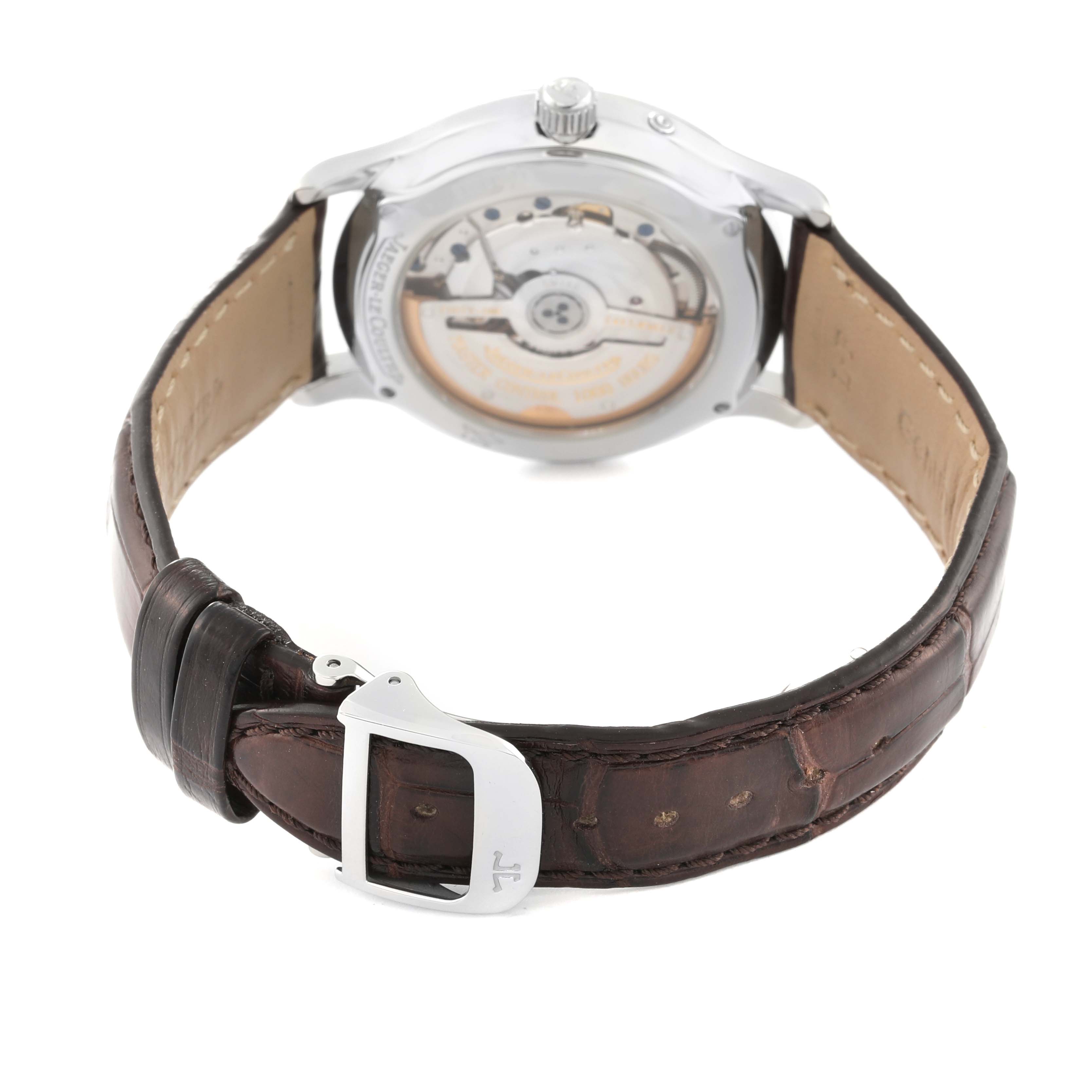 The image shows the back view of a Jaeger-LeCoultre Master watch, highlighting its transparent case back and leather strap.