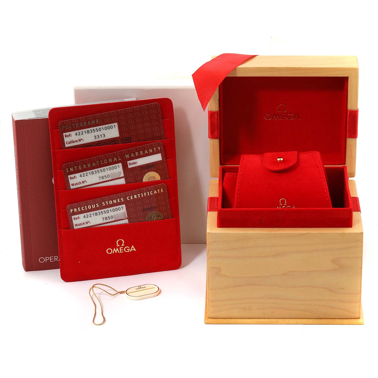 The image shows the box, international warranty cards, and the outer packaging of the Omega 422.18.35.50.10.001 Women's Stainless Steel Purple Dial 422.18.35.50.10.001 Women's Stainless Steel Purple Dial DeVille Co-Axial Steel Diamond Ladies Watch 422.18.35.50.10.001.