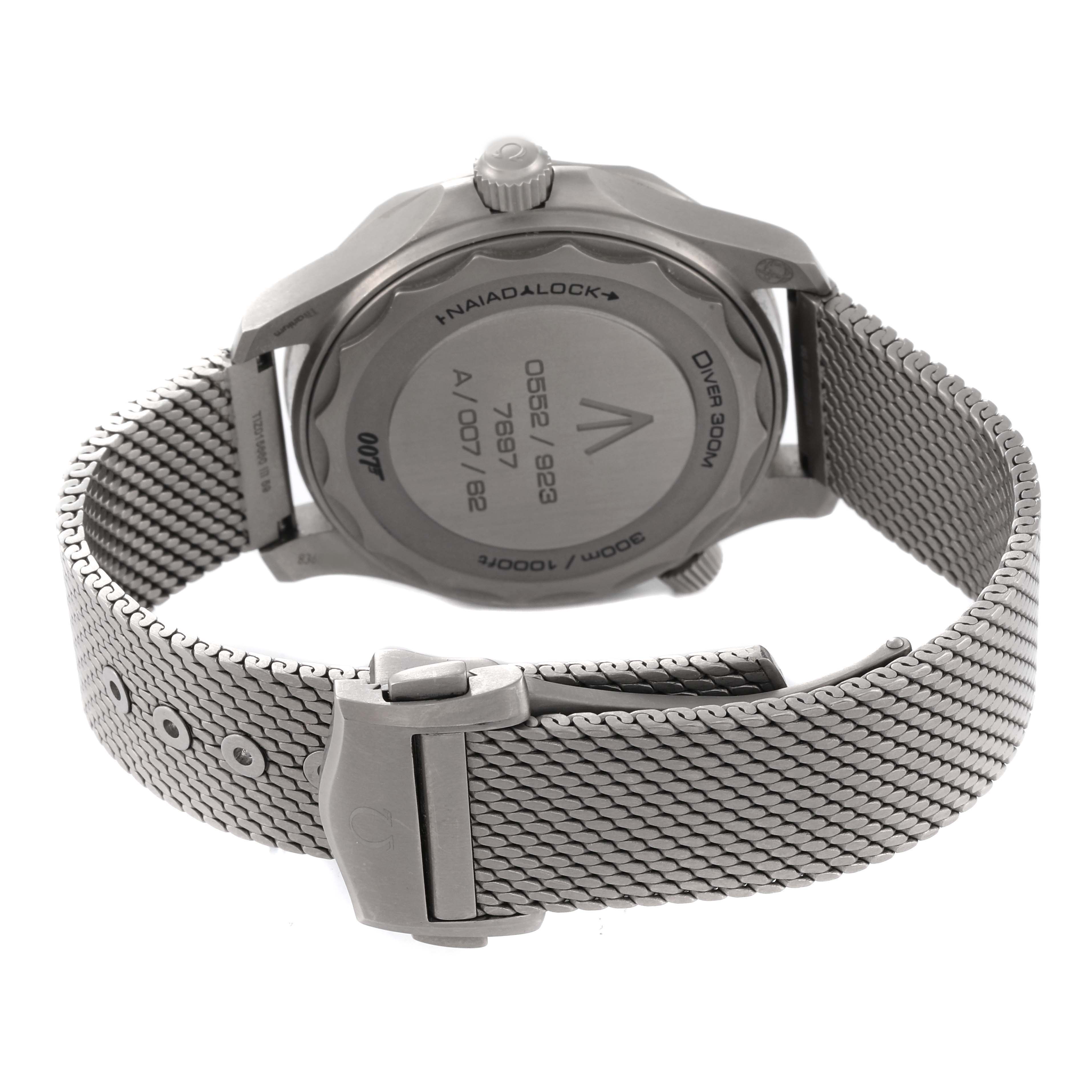 The image shows the back and clasp of an Omega Seamaster 210.90.42.20.01.001 Men's Titanium Brown Dial 210.90.42.20.01.001 Men's Titanium Brown Dial watch, focusing on its case back and metal bracelet.