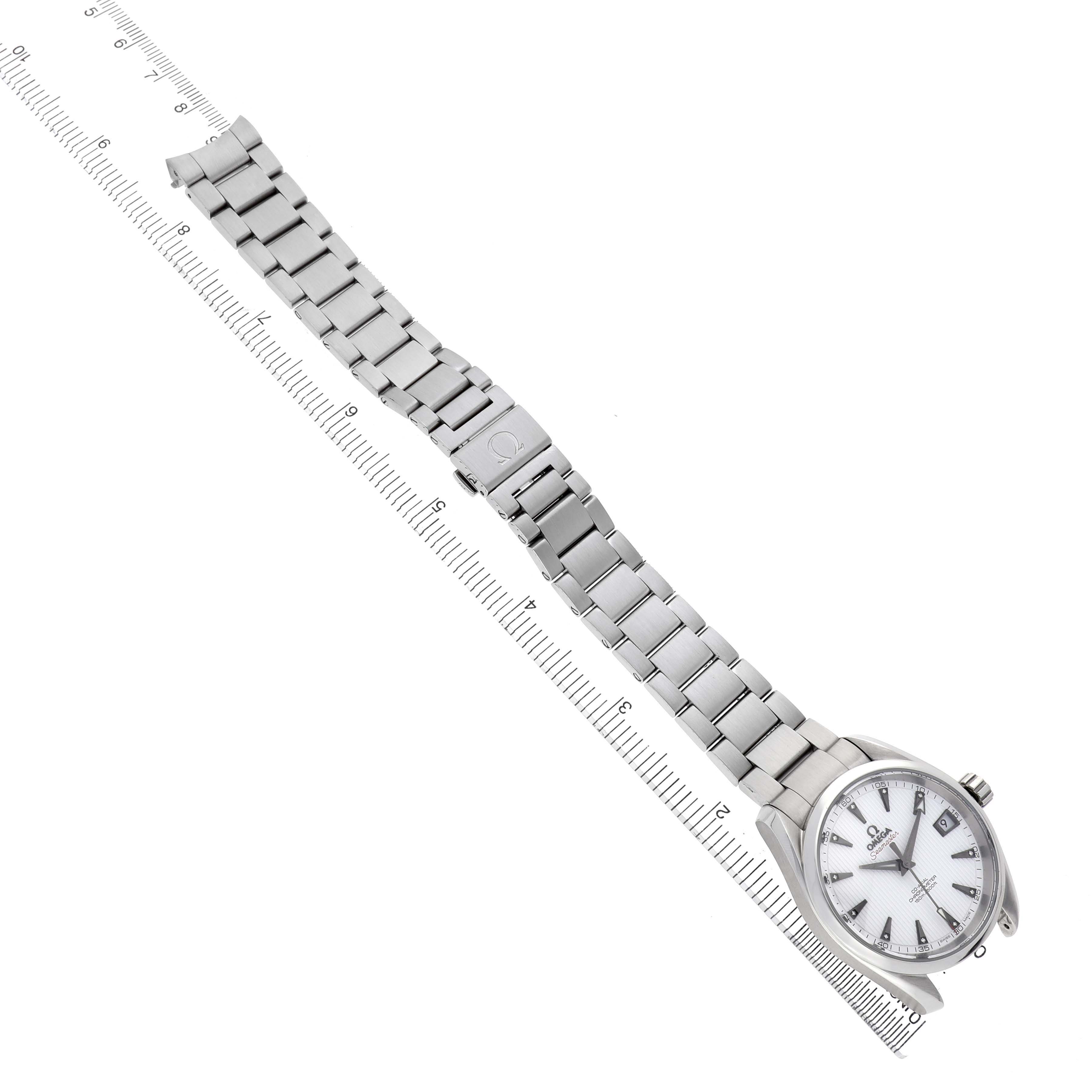 The Omega Seamaster 231.10.39.21.54.001 Men's Stainless Steel White Dial watch is shown at a top-down angle with its full metal bracelet and clasp visible alongside measuring scales.
